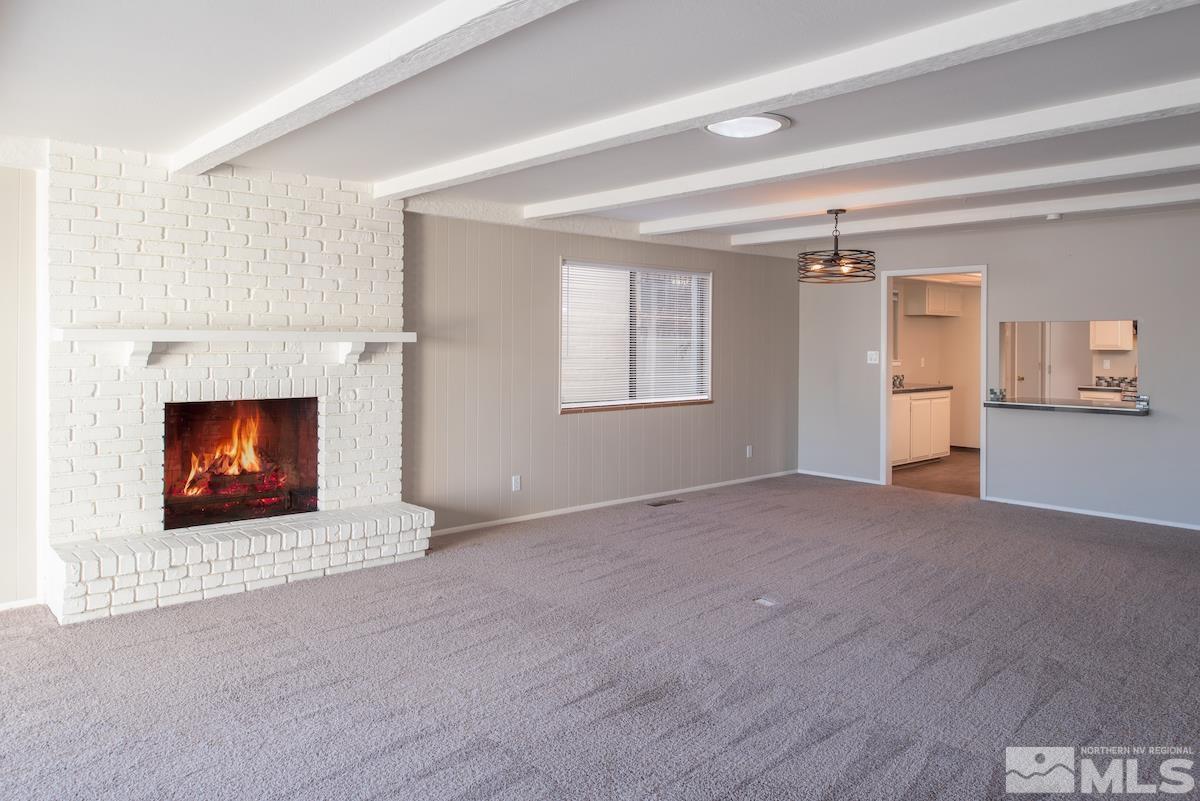 5038 Lakeridge Terrace East Reno, NV 89509 - Photo 4 of 23 a view of an empty room with window and fire place