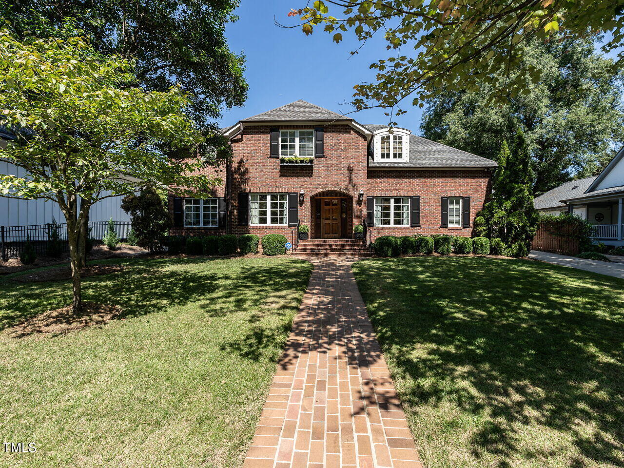 2624 Wells Avenue Raleigh, NC 27608 - Photo 1 of 35 a front view of a house with a yard