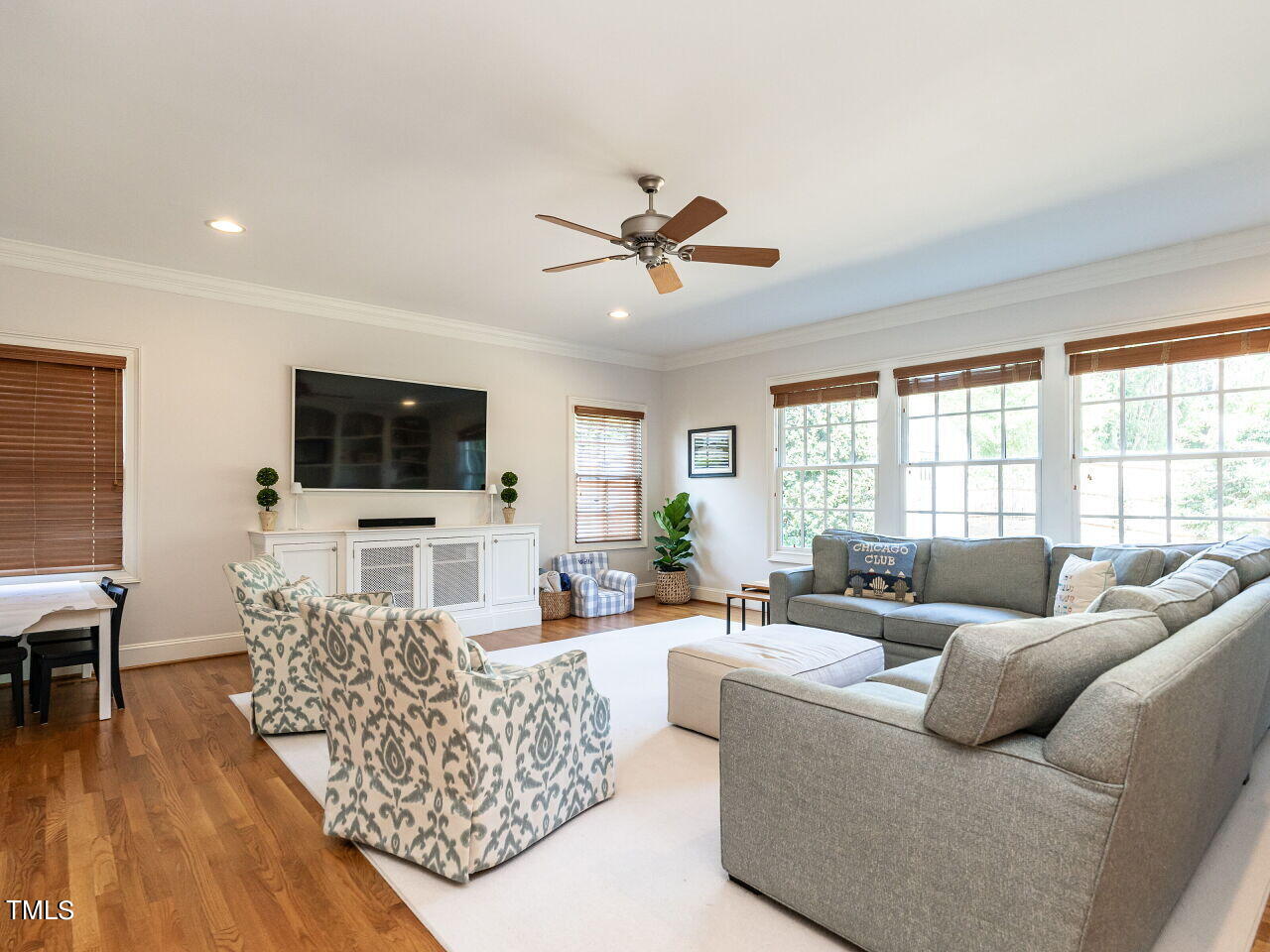 2624 Wells Avenue Raleigh, NC 27608 - Photo 11 of 35 a living room with furniture and a flat screen tv