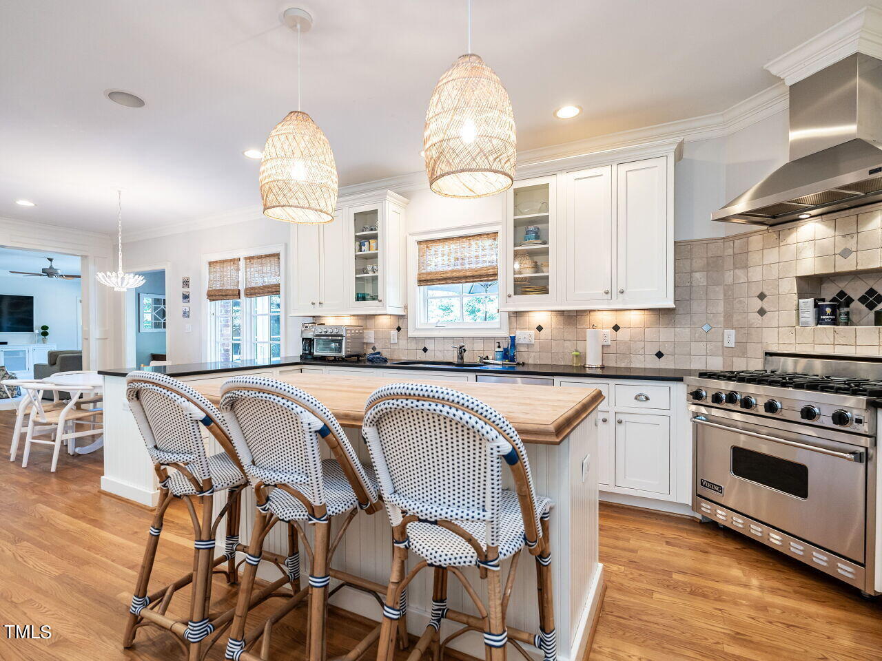 2624 Wells Avenue Raleigh, NC 27608 - Photo 18 of 35 a kitchen with a table chairs sink and cabinets