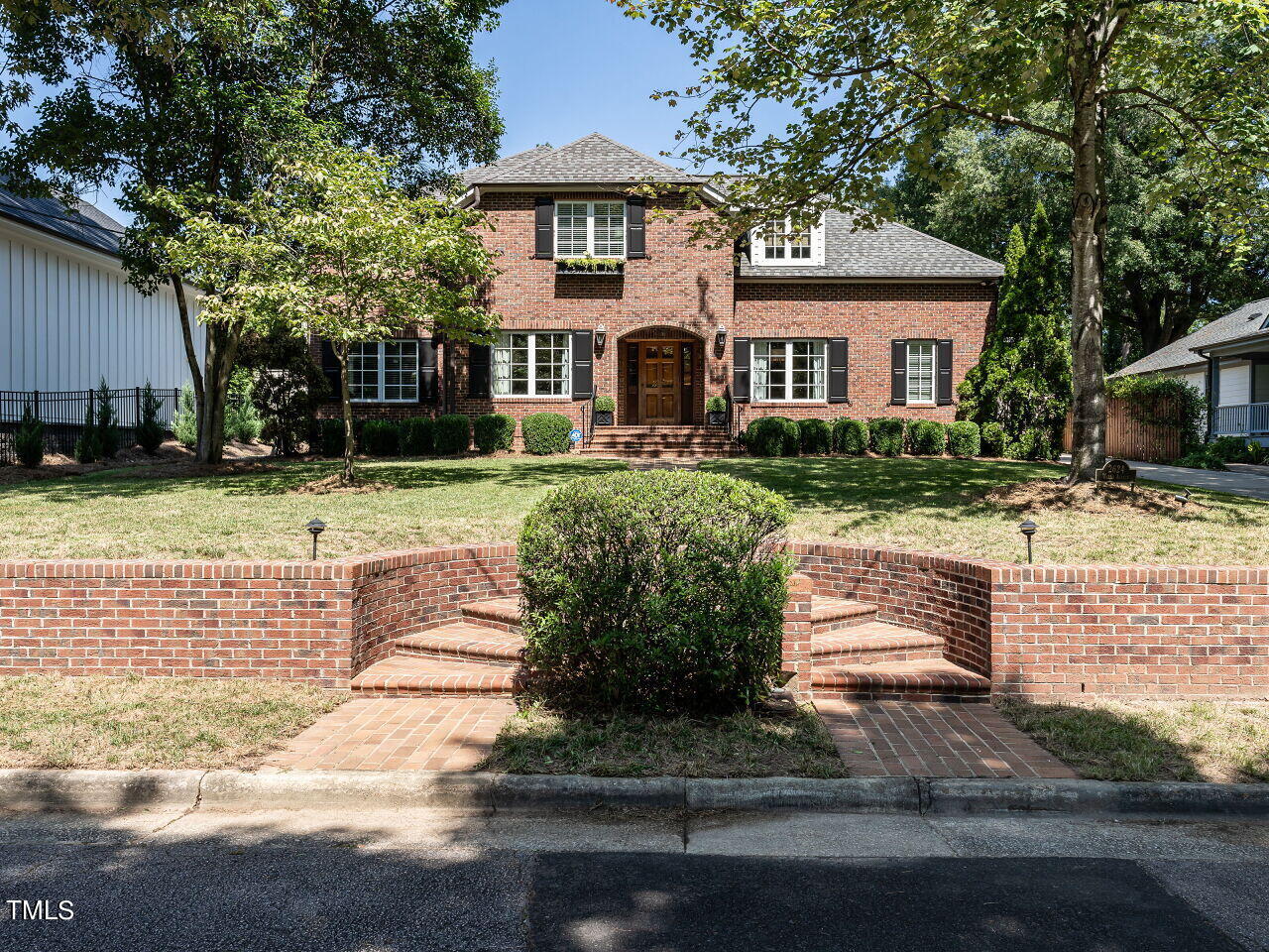 2624 Wells Avenue Raleigh, NC 27608 - Photo 2 of 35 a front view of a house with a yard