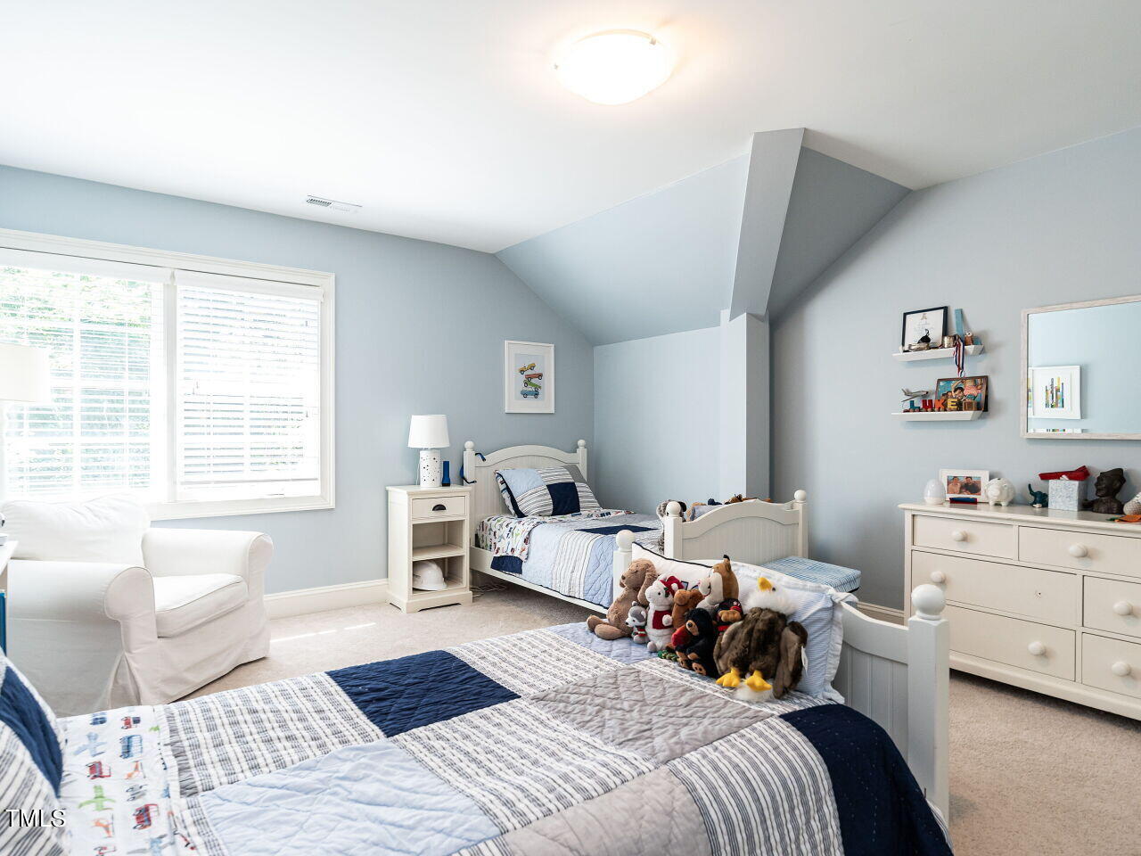 2624 Wells Avenue Raleigh, NC 27608 - Photo 30 of 35 a bedroom with a bed and a window