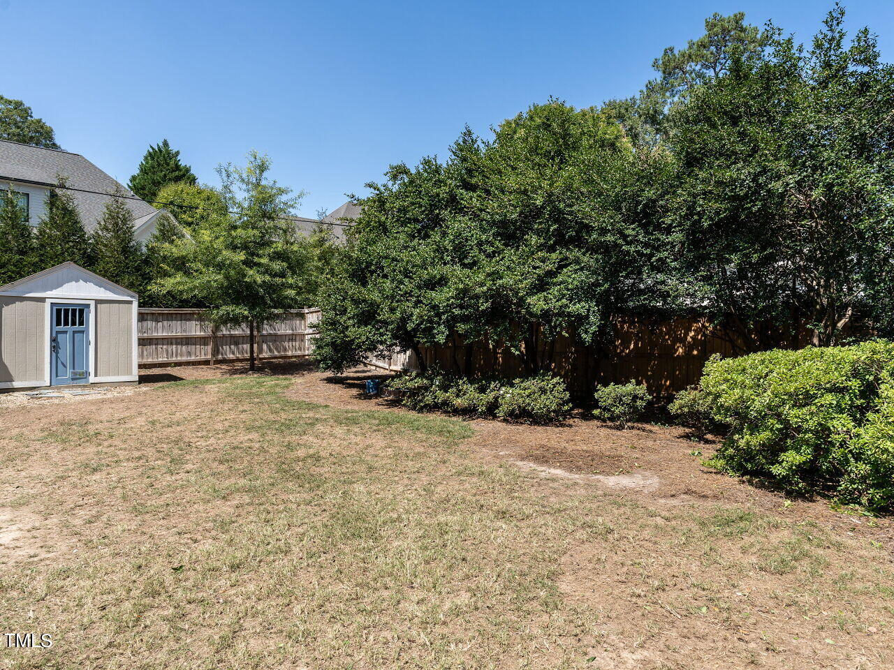 2624 Wells Avenue Raleigh, NC 27608 - Photo 35 of 35 a backyard of a house with lots of green space