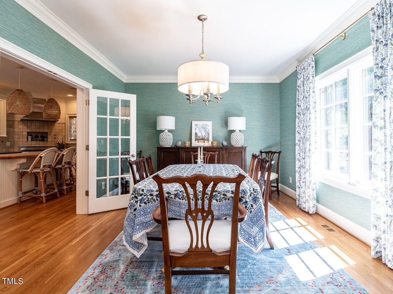 2624 Wells Avenue Raleigh, NC 27608 - Photo 8 of 35 a view of a dining room with furniture window and wooden floor