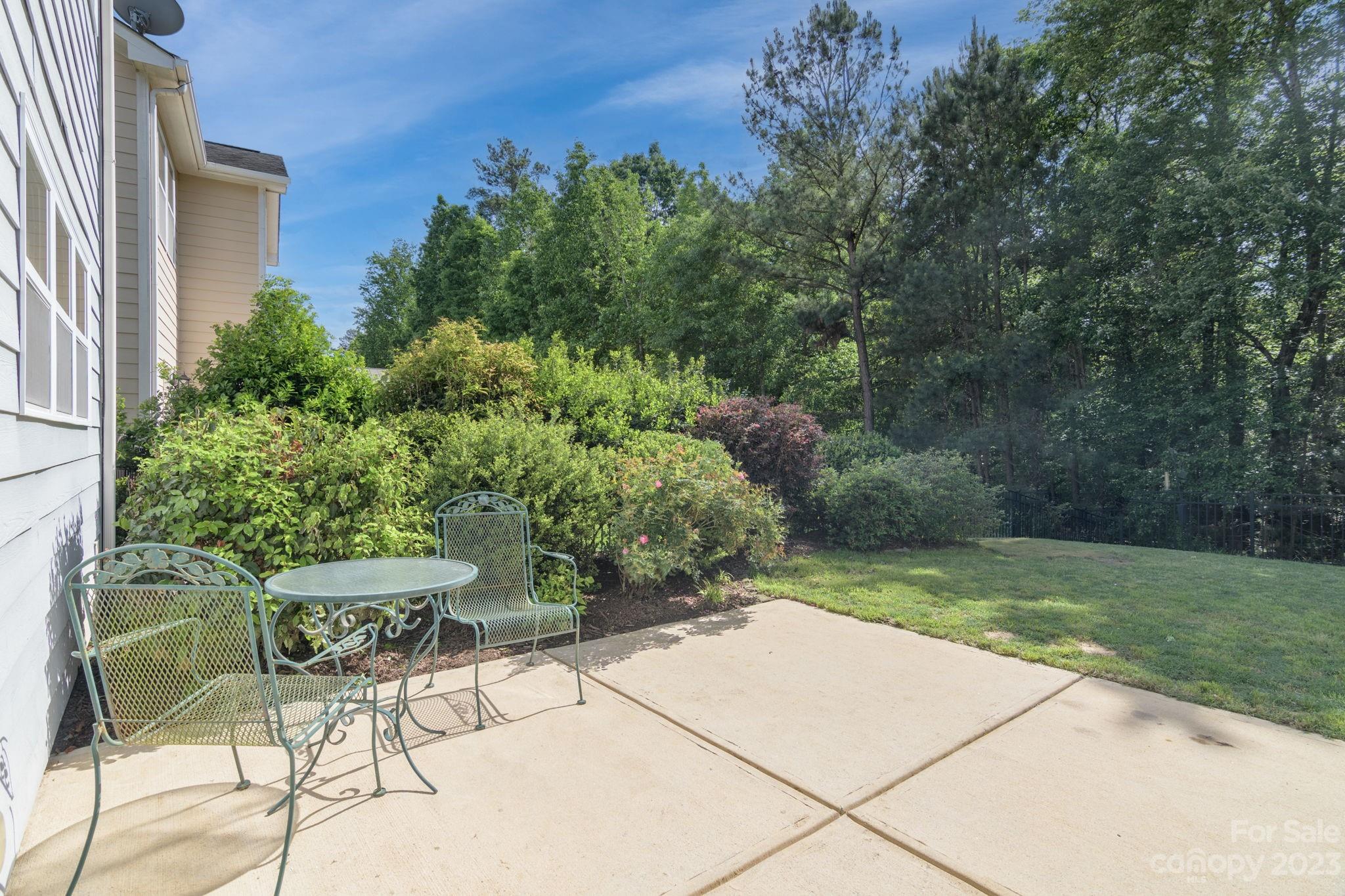 2191 Bluebell Way Tega Cay, SC 29708 - Photo 34 of 36 a view of backyard with outdoor seating and green space