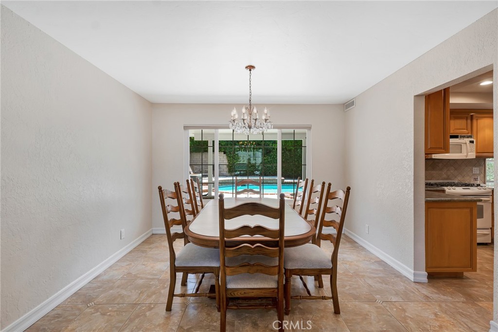 2146 North Brower Street Simi Valley, CA 93065 - Photo 16 of 51 a dining room with furniture a chandelier and window