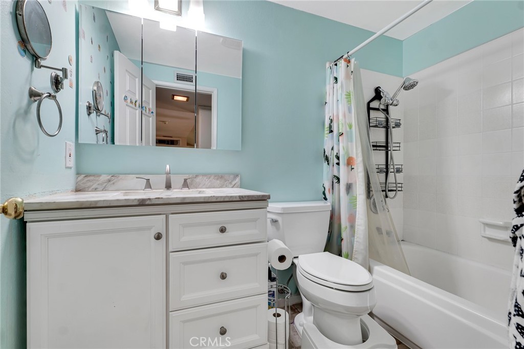 2146 North Brower Street Simi Valley, CA 93065 - Photo 38 of 51 a bathroom with a granite countertop sink toilet and shower