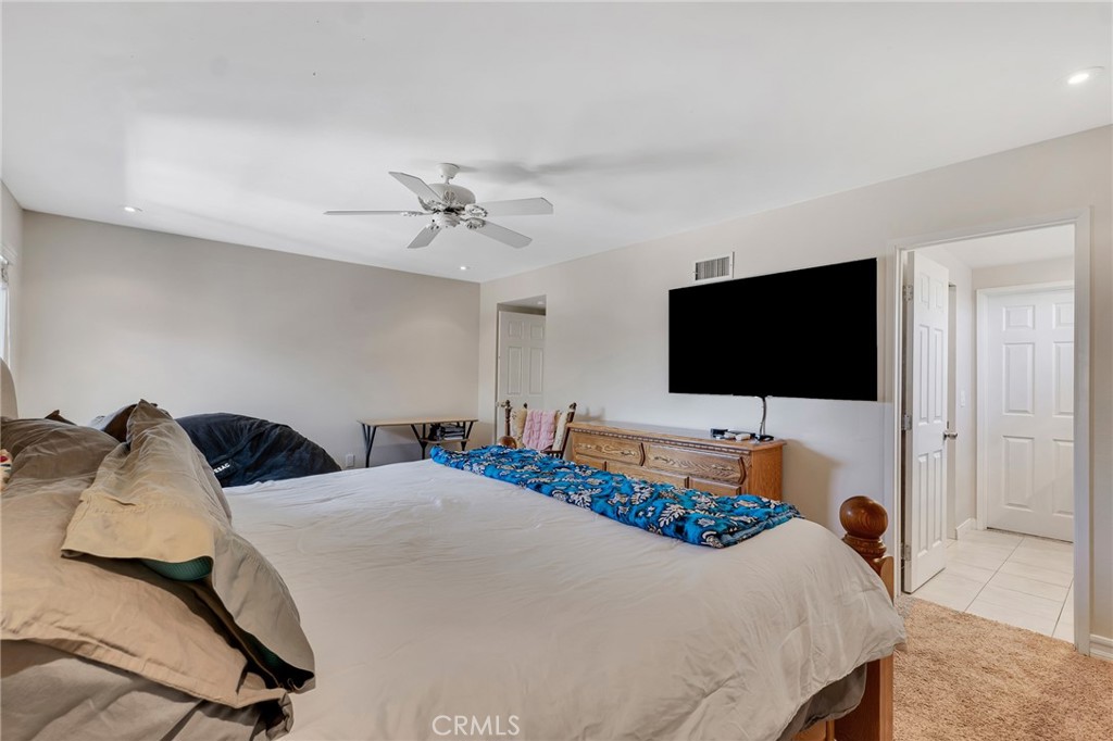 2146 North Brower Street Simi Valley, CA 93065 - Photo 43 of 51 a bedroom with a bed and a flat screen tv