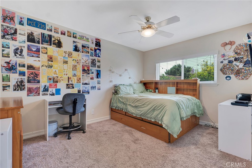 2146 North Brower Street Simi Valley, CA 93065 - Photo 46 of 51 a bedroom with a bed and a chandelier