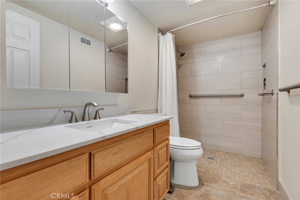 2146 North Brower Street Simi Valley, CA 93065 - Photo 10 of 51 a bathroom with a sink a toilet and shower