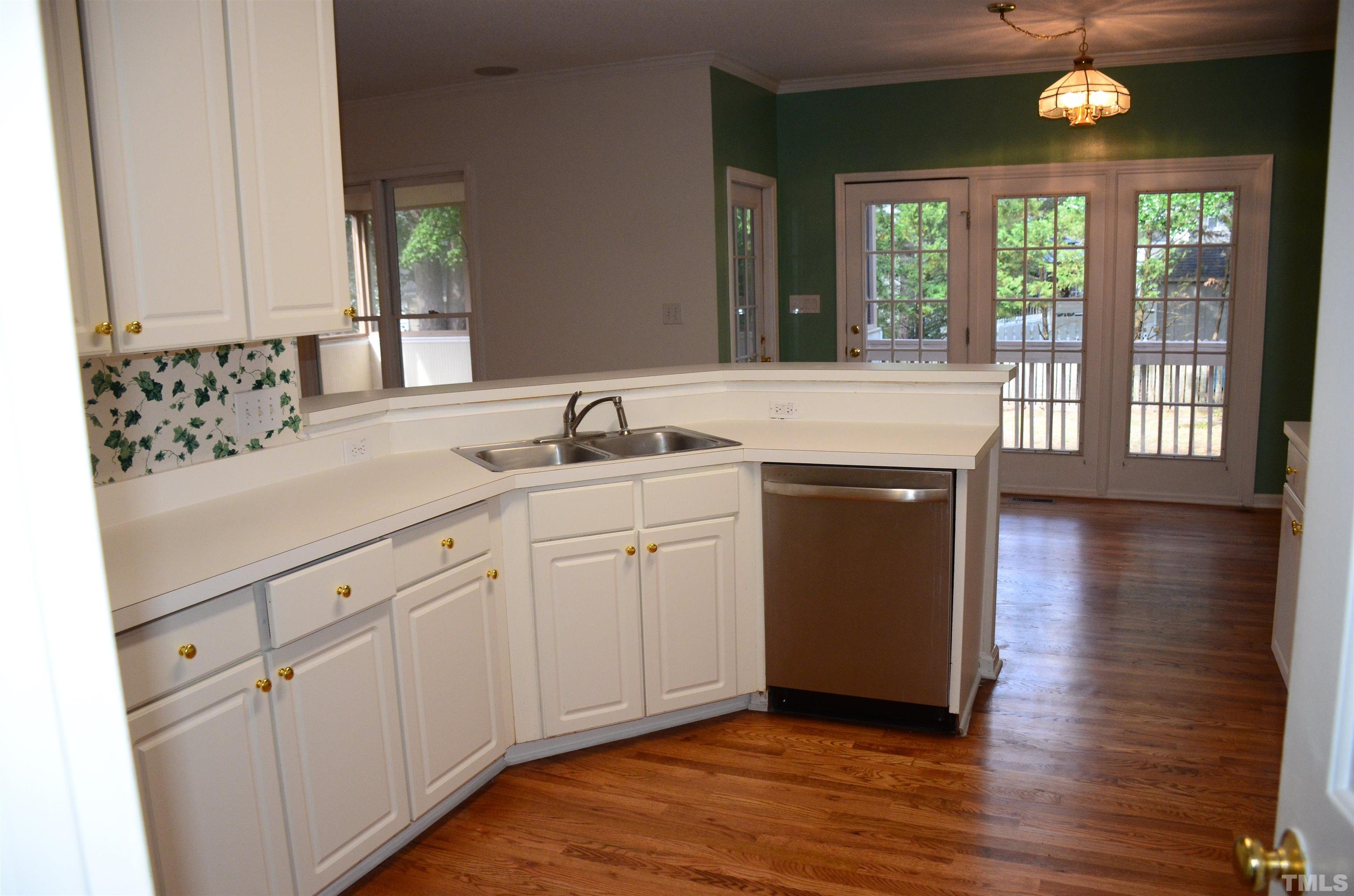 118 Covington Square Drive Cary, NC 27513 - Photo 12 of 58 a spacious bathroom with a granite countertop sink and a mirror