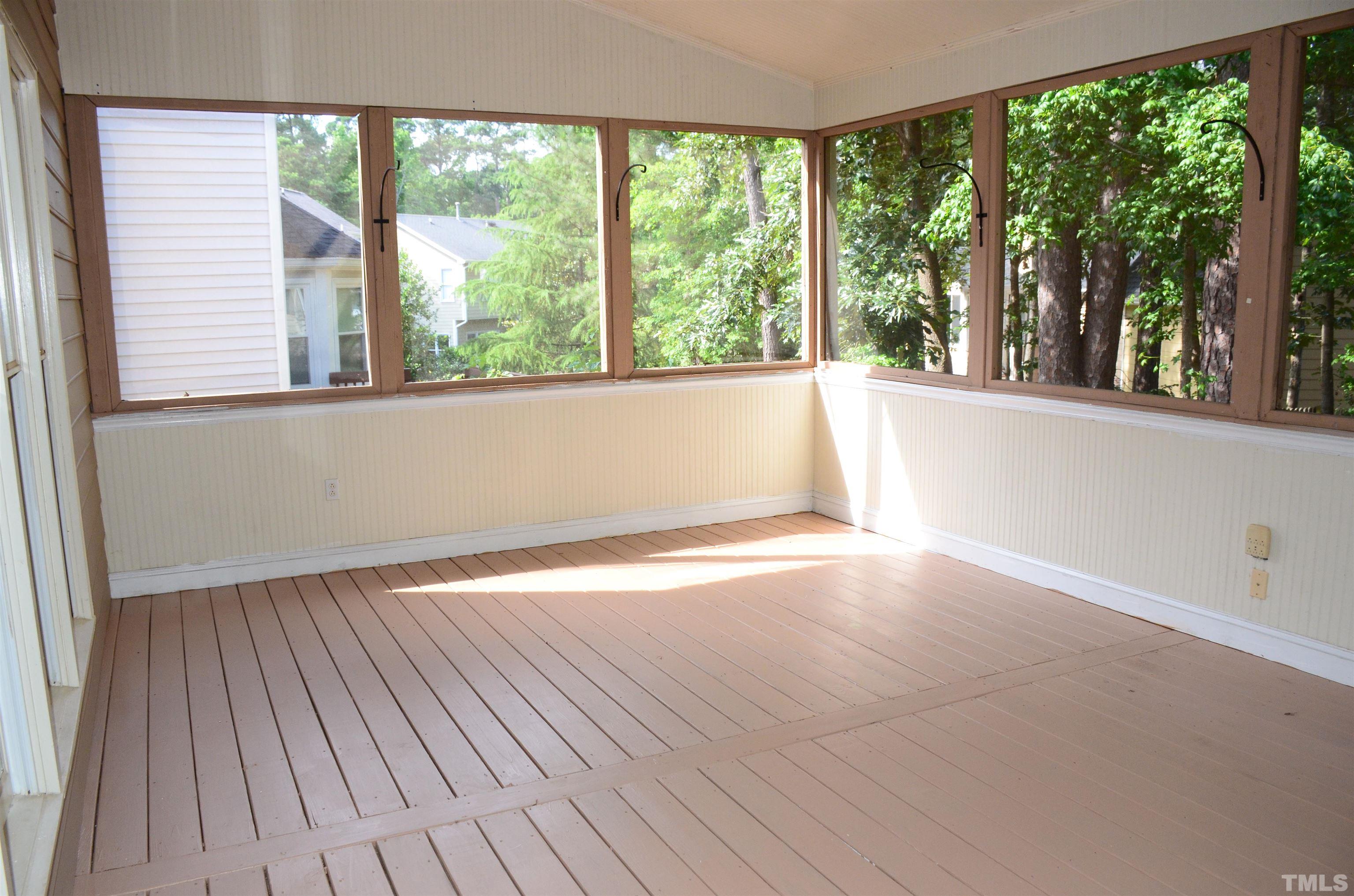 118 Covington Square Drive Cary, NC 27513 - Photo 23 of 58 an empty room with wooden floor and windows