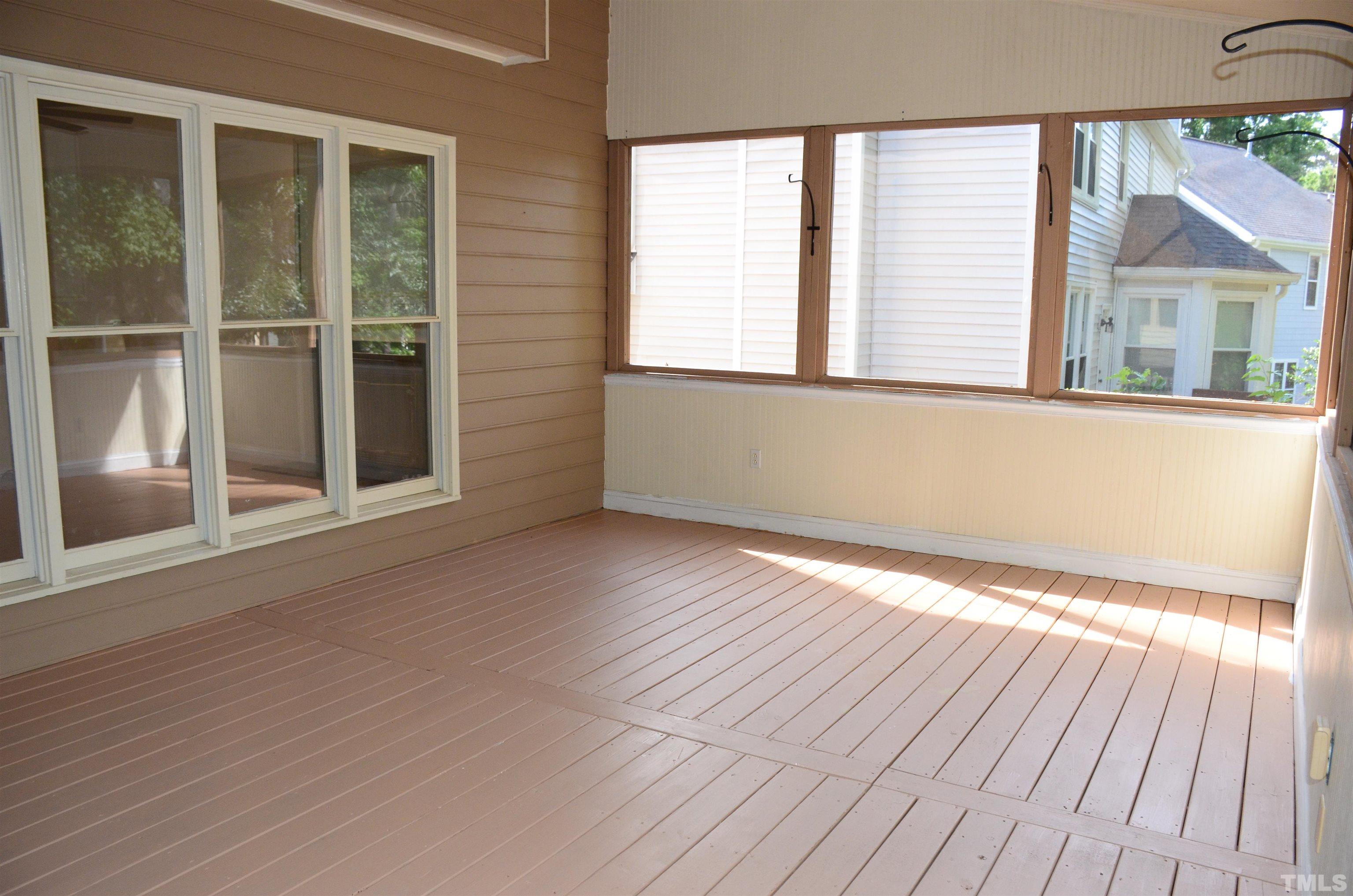 118 Covington Square Drive Cary, NC 27513 - Photo 24 of 58 an empty room with wooden floor and windows