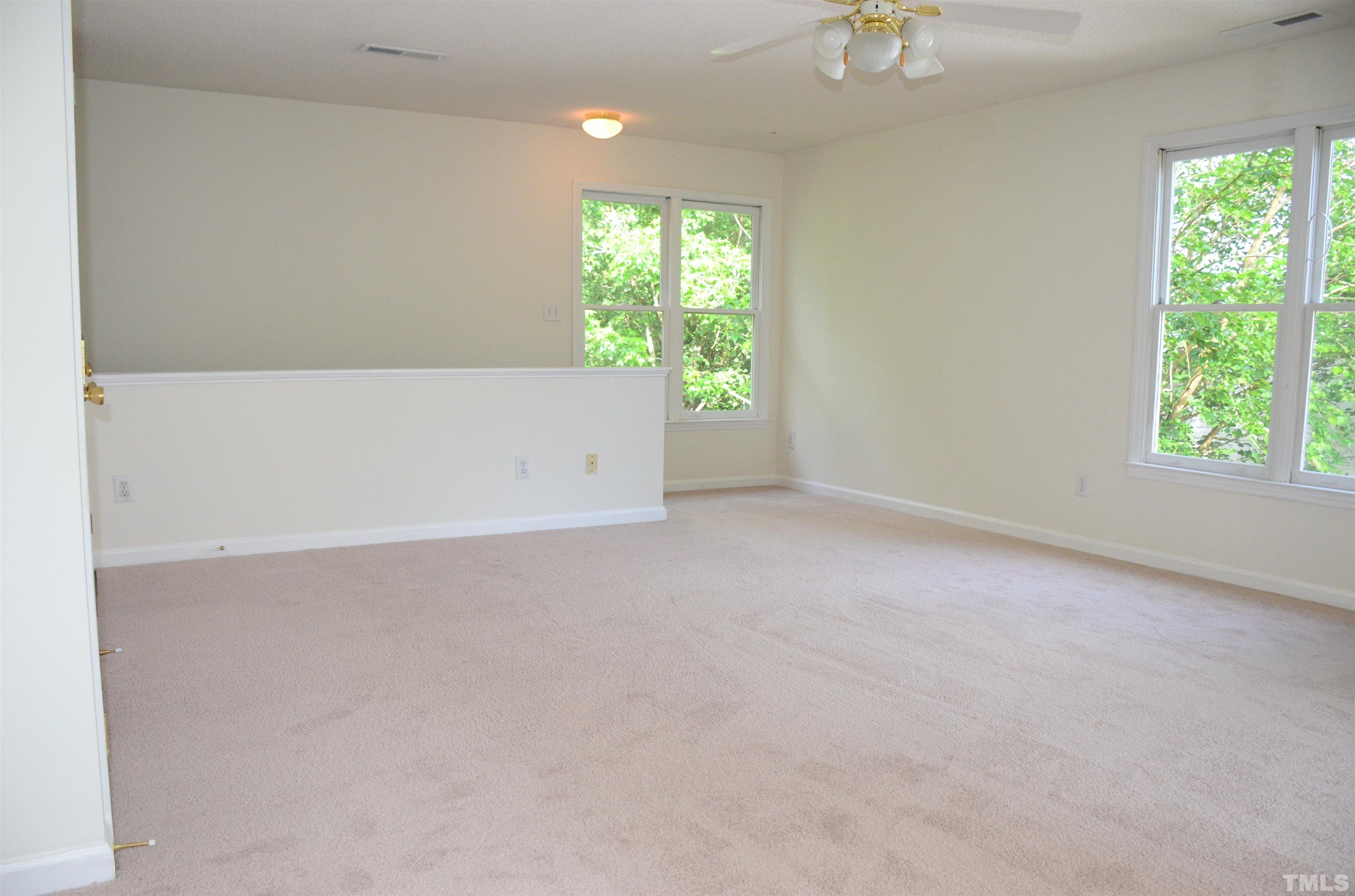 118 Covington Square Drive Cary, NC 27513 - Photo 27 of 58 an empty room with windows