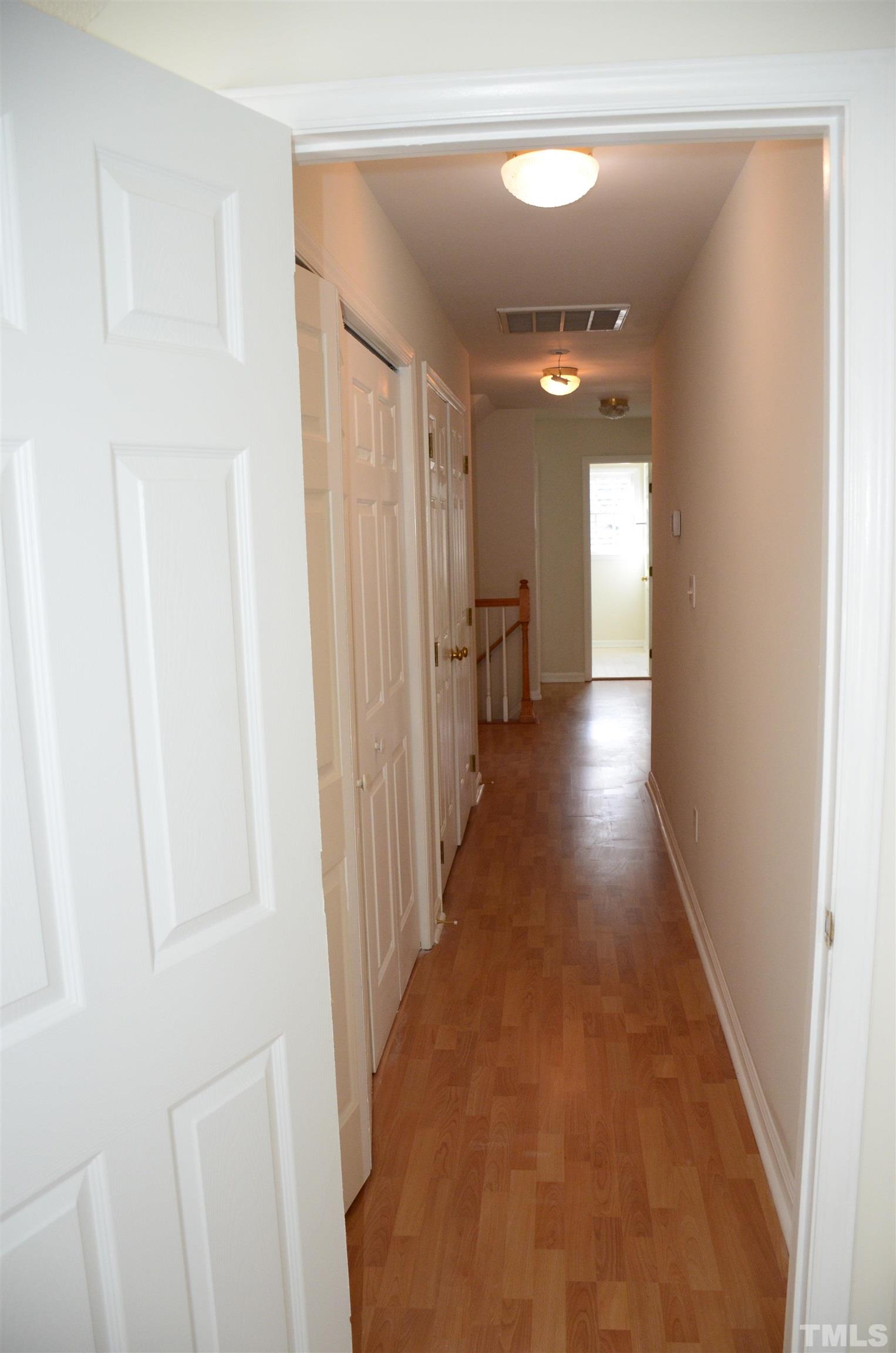 118 Covington Square Drive Cary, NC 27513 - Photo 28 of 58 a view of a hallway with wooden floor