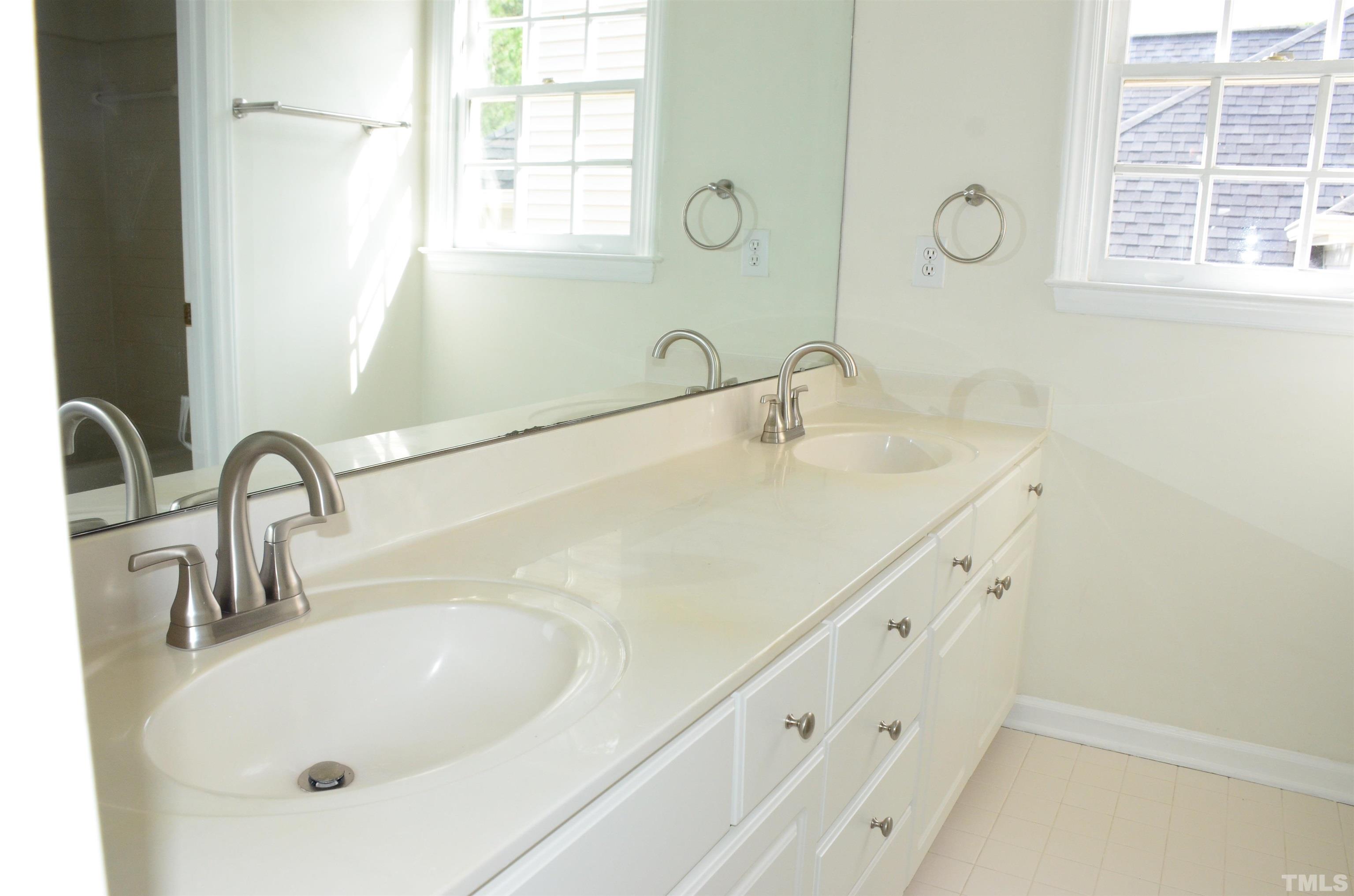 118 Covington Square Drive Cary, NC 27513 - Photo 34 of 58 a bathroom with a sink and a mirror