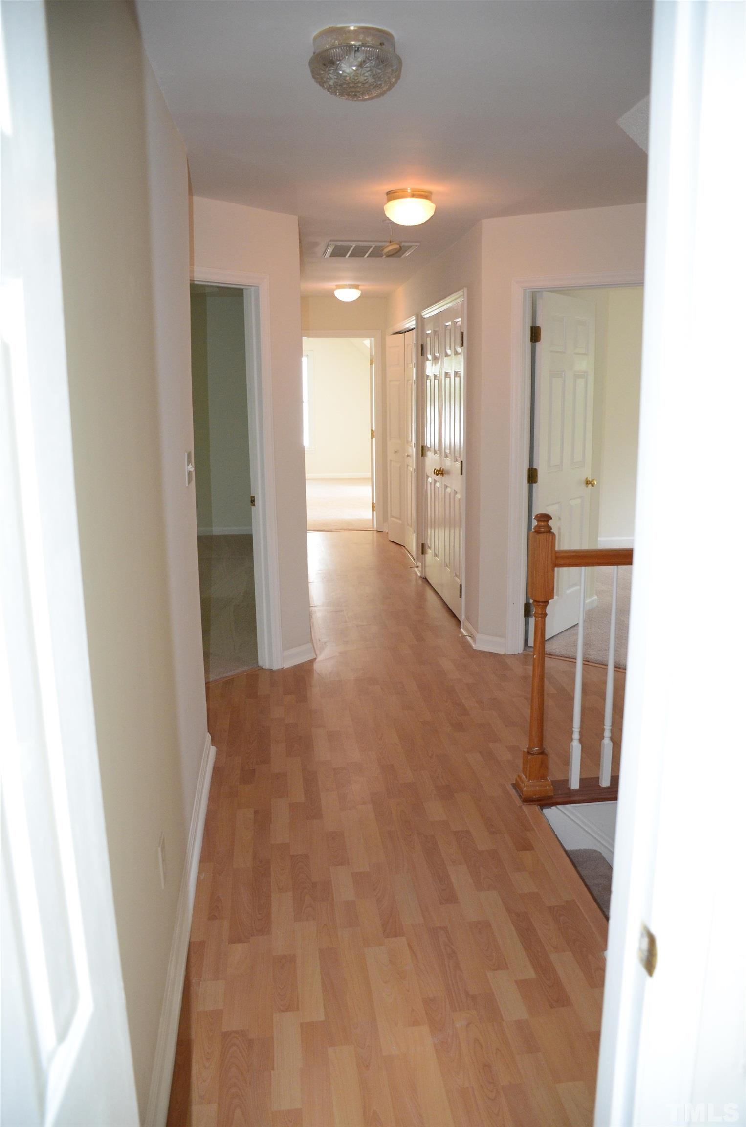 118 Covington Square Drive Cary, NC 27513 - Photo 35 of 58 a view of a hallway with a bathroom
