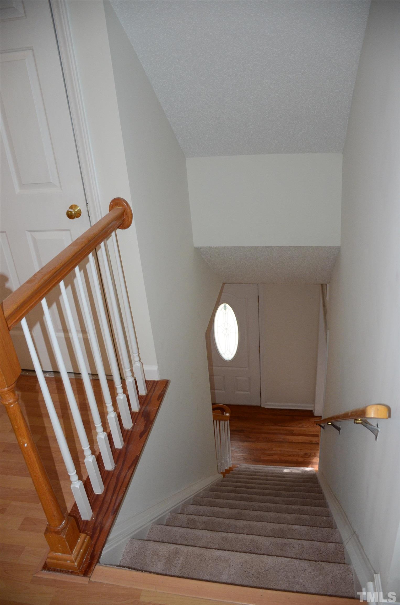 118 Covington Square Drive Cary, NC 27513 - Photo 36 of 58 a view of a room with wooden floor and white walls