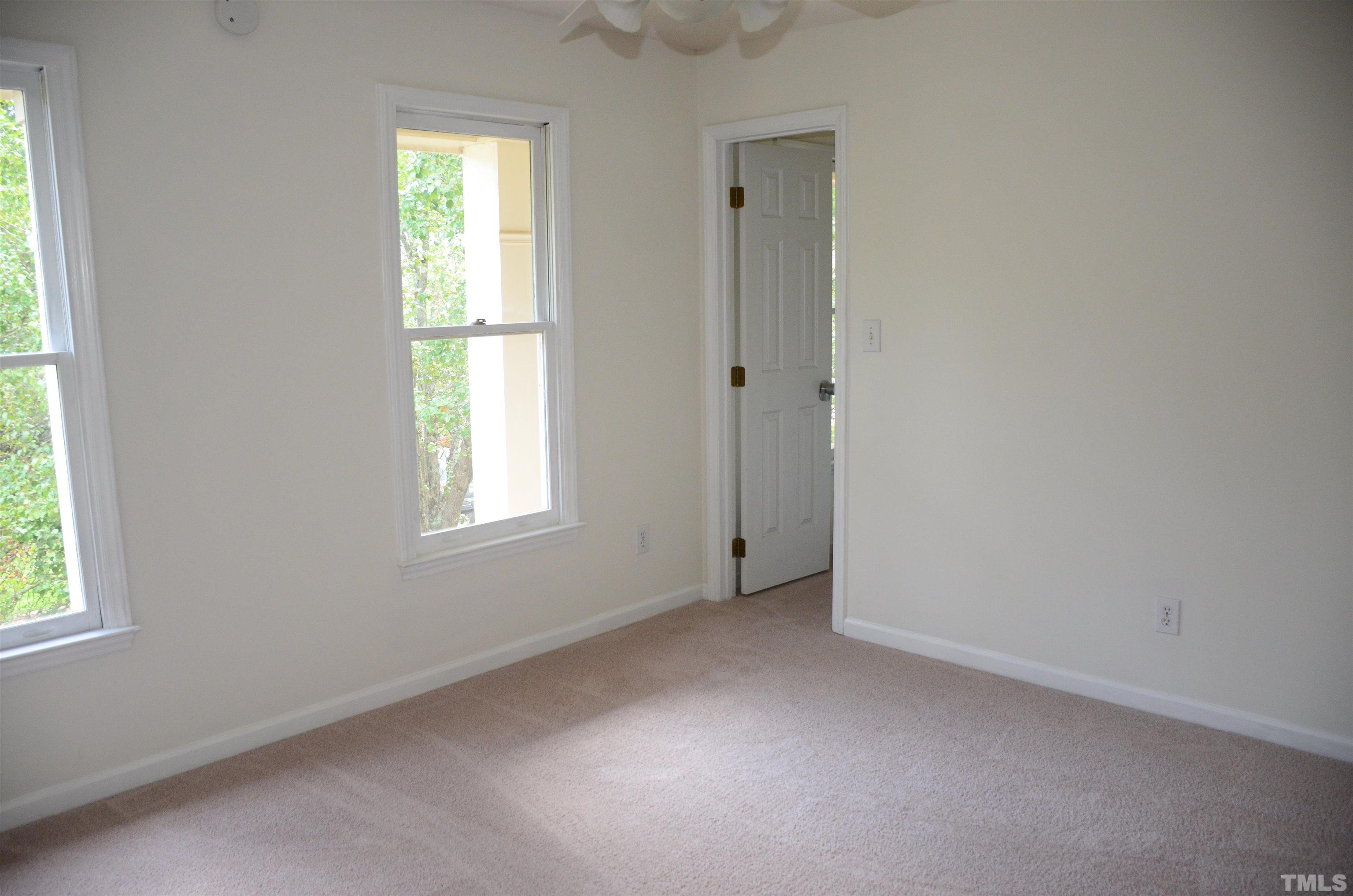 118 Covington Square Drive Cary, NC 27513 - Photo 39 of 58 an empty room with windows