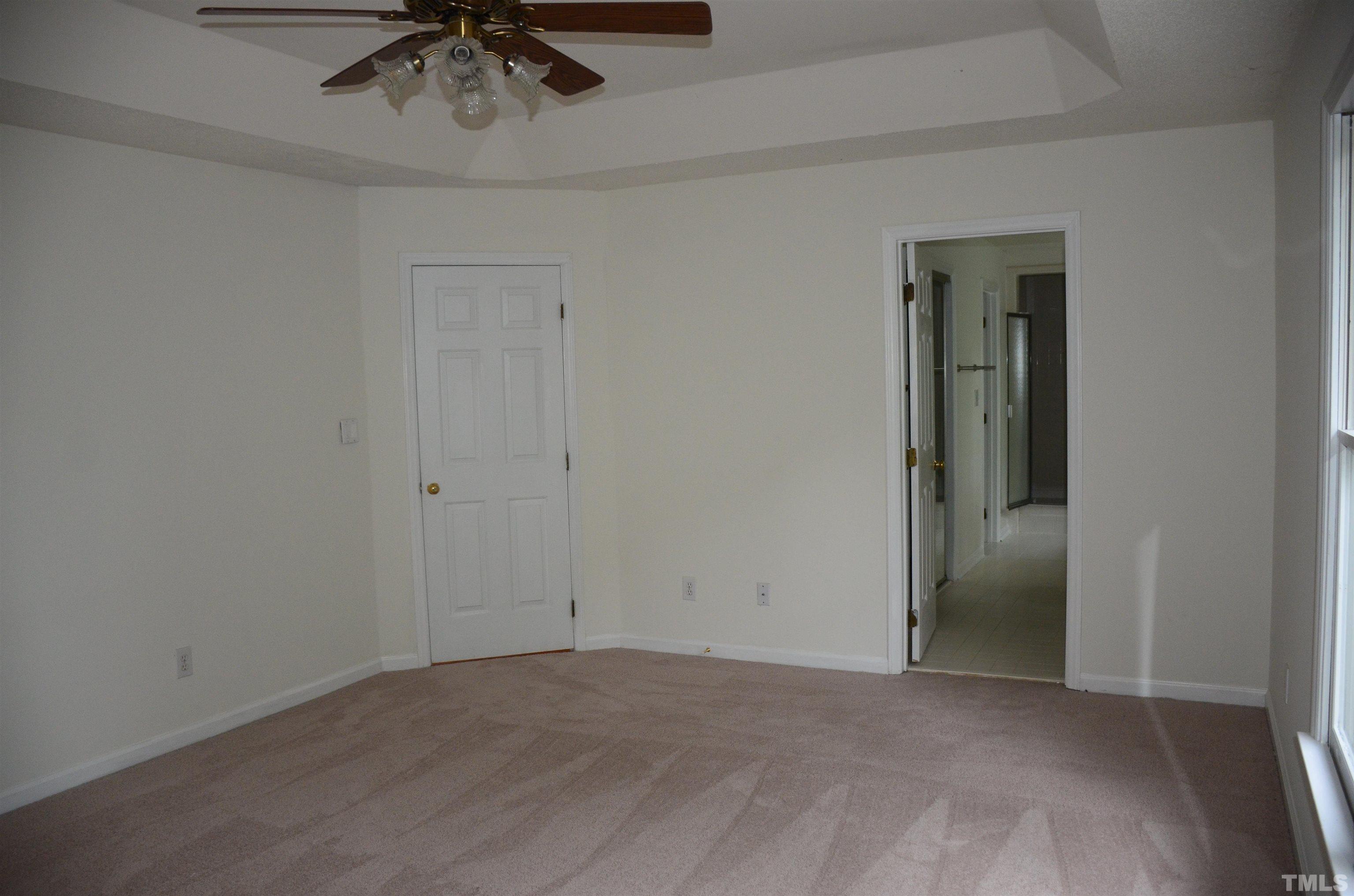 118 Covington Square Drive Cary, NC 27513 - Photo 43 of 58 an empty room with a ceiling fan