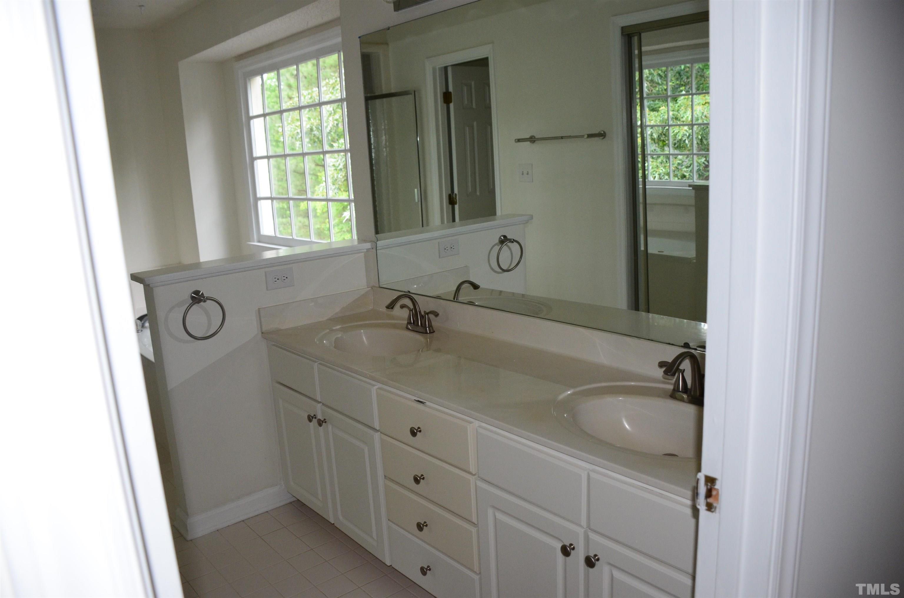 118 Covington Square Drive Cary, NC 27513 - Photo 44 of 58 a bathroom with 2 sink and a window
