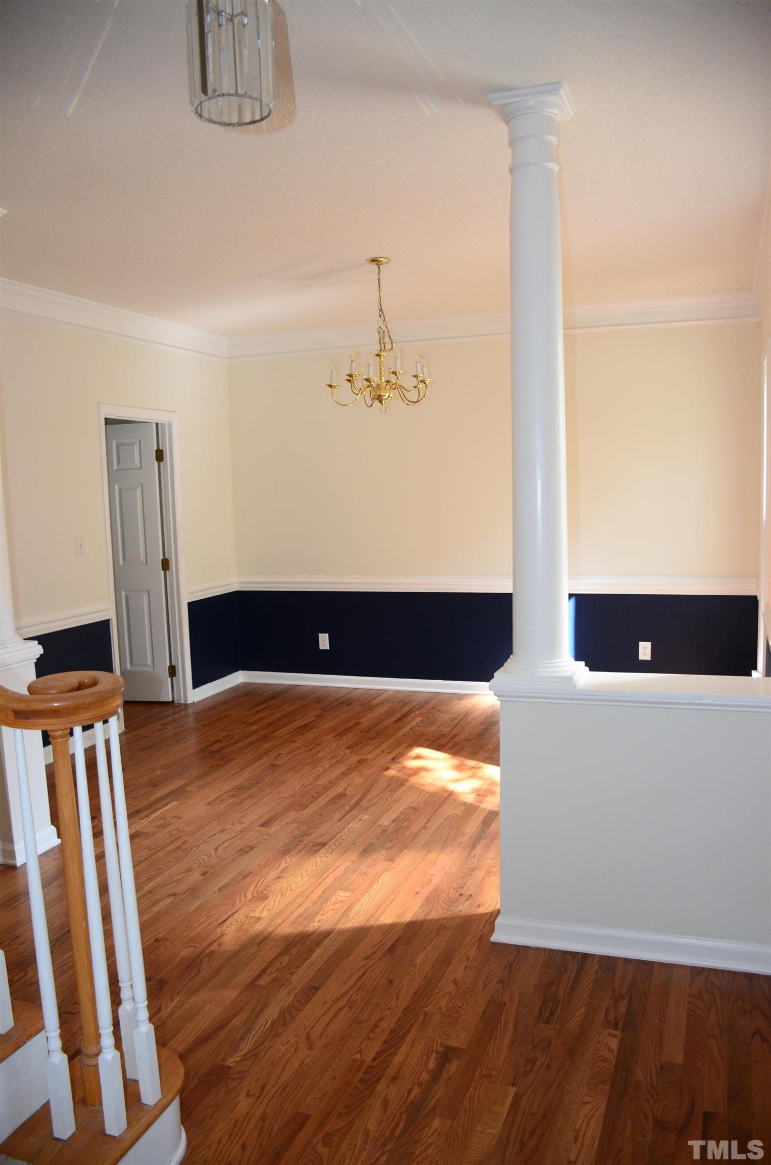 118 Covington Square Drive Cary, NC 27513 - Photo 6 of 58 a view of an empty room with furniture and a gate
