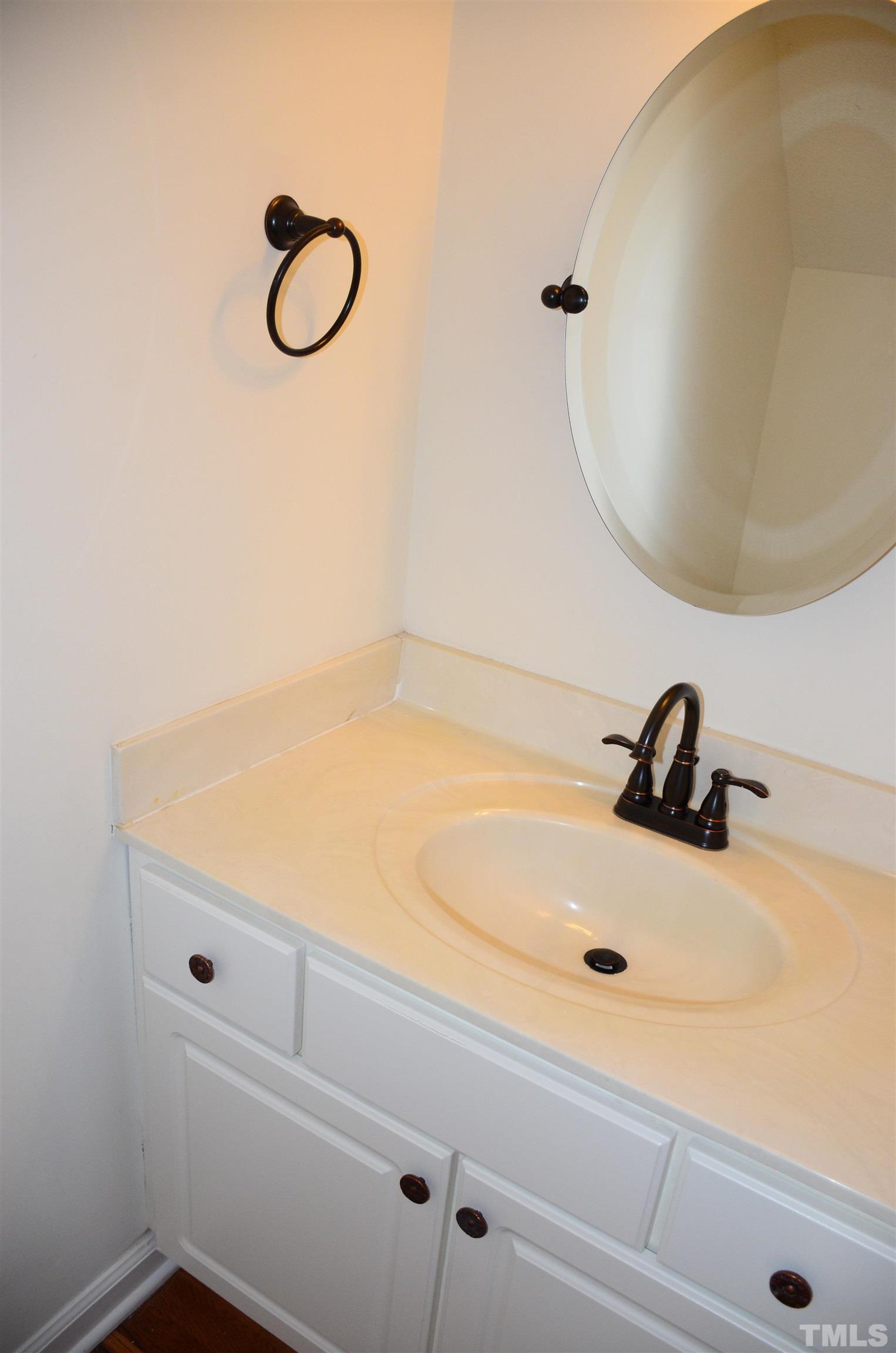 118 Covington Square Drive Cary, NC 27513 - Photo 8 of 58 a bathroom with a sink and a mirror