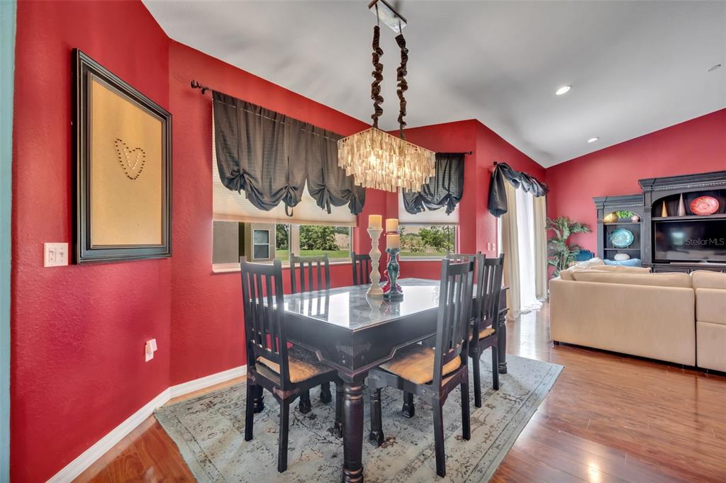 4946 Northeast 124th Road Oxford, FL 34484 - Photo 14 of 69 a view of a dining room with furniture window and wooden floor