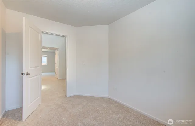 a view of a room with a hallway