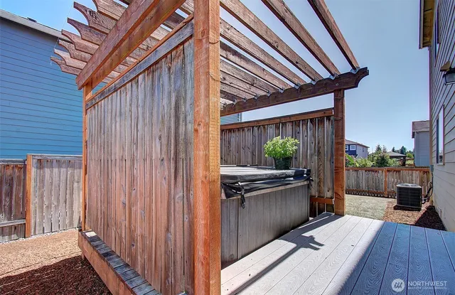 a view of balcony with wooden floor and outdoor seating