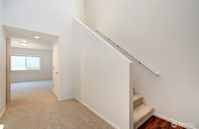 a view of a hallway with staircase