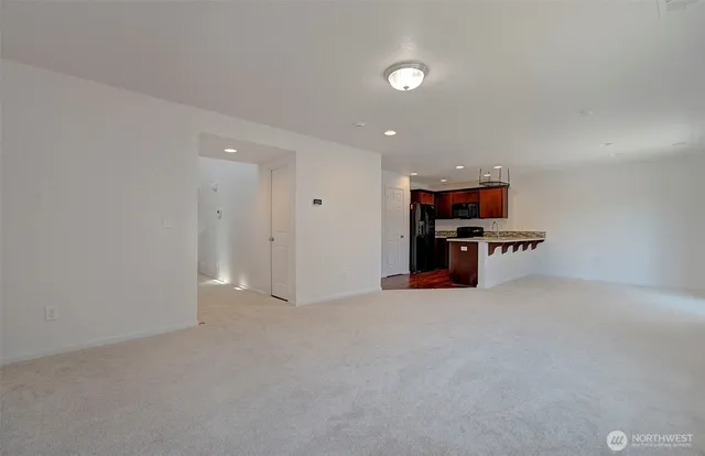 a view of empty room with furniture