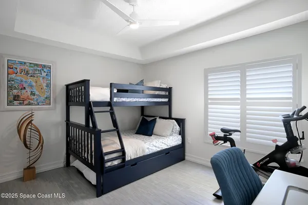 a bedroom with furniture and a window