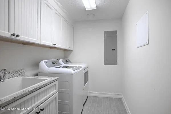 a view of storage and utility room with washer and dryer