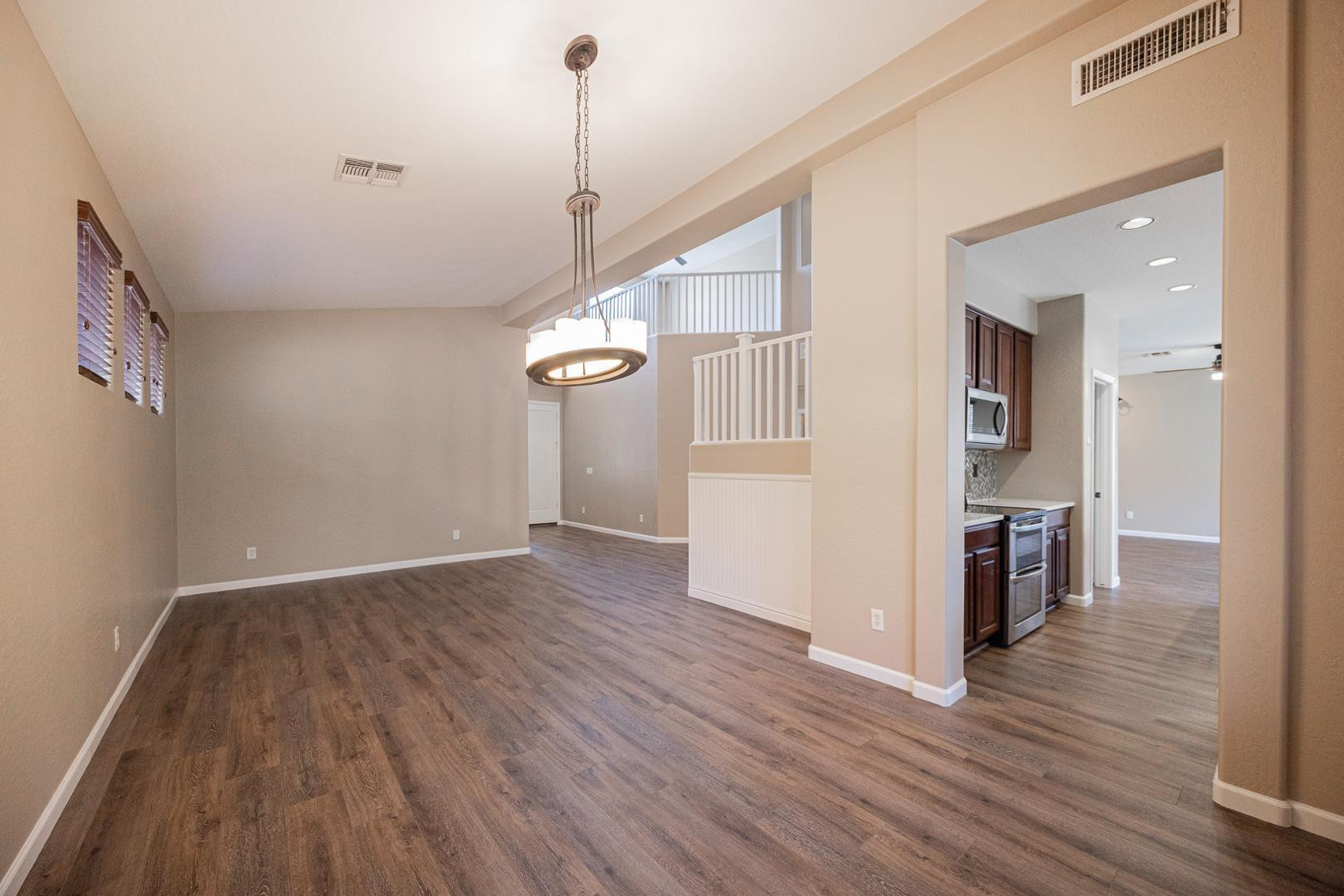 6539 West Jomax Road Phoenix, AZ 85083 - Photo 10 of 39 a view of empty room with wooden floor