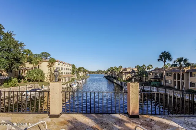 a view of park with iron fence