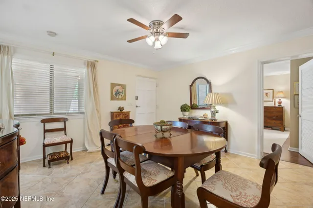 a dining room with furniture and window