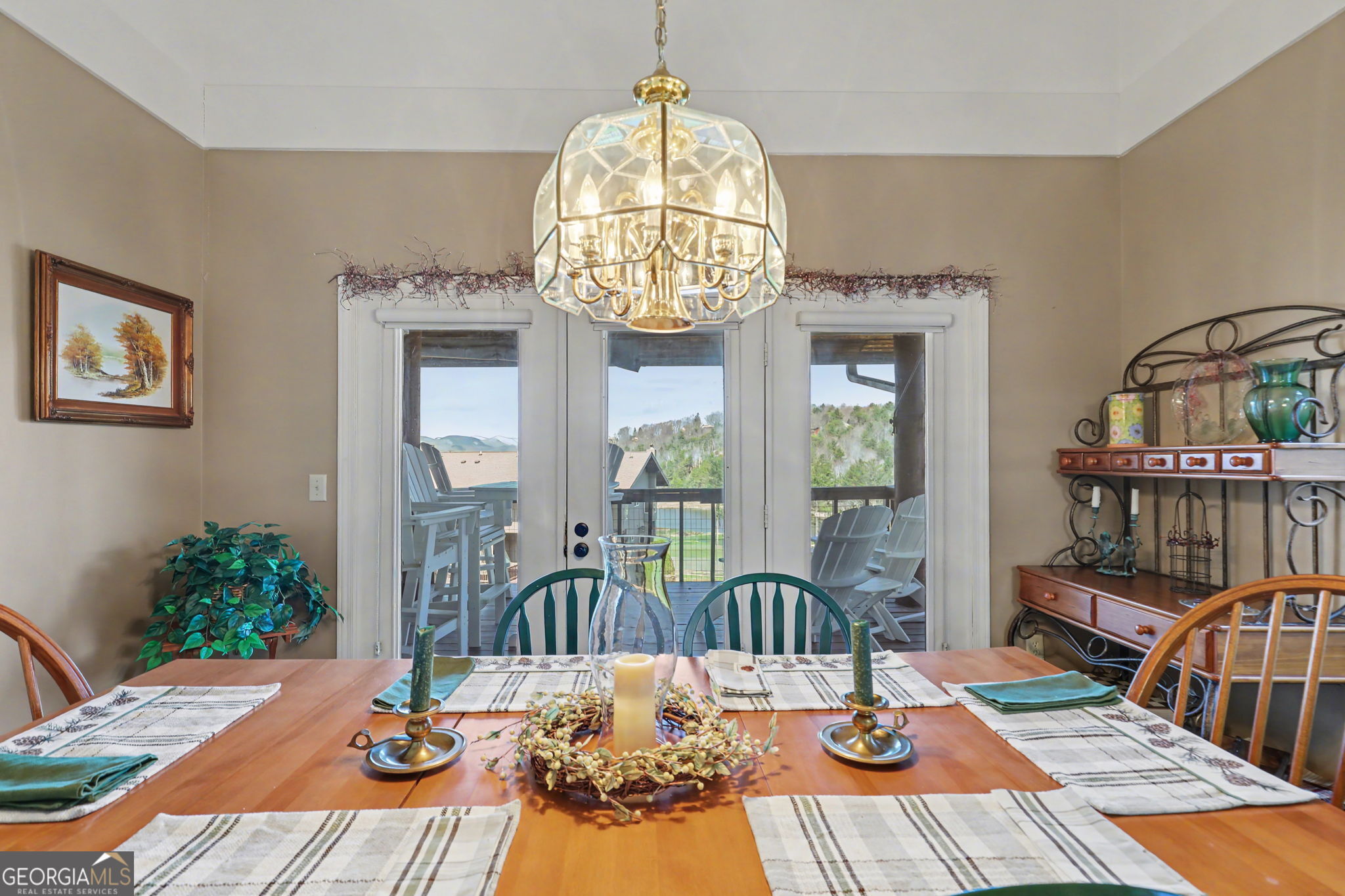 62 Sunvalley Circle, Unit 7006 Dillard, GA 30537 - Photo 12 of 55 a view of a dining room with furniture wooden floor and chandelier