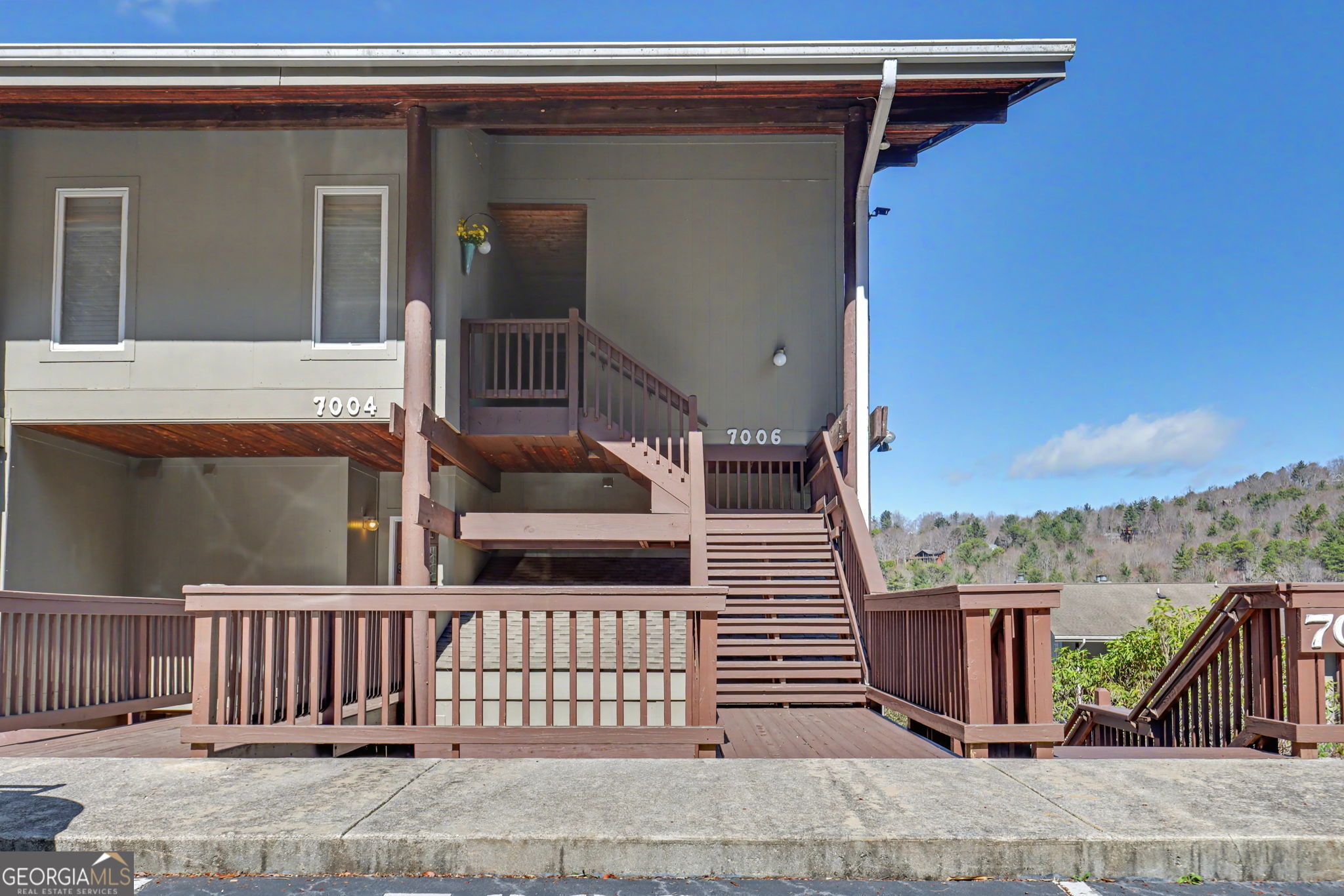 62 Sunvalley Circle, Unit 7006 Dillard, GA 30537 - Photo 2 of 55 front view of a house with a wooden fence