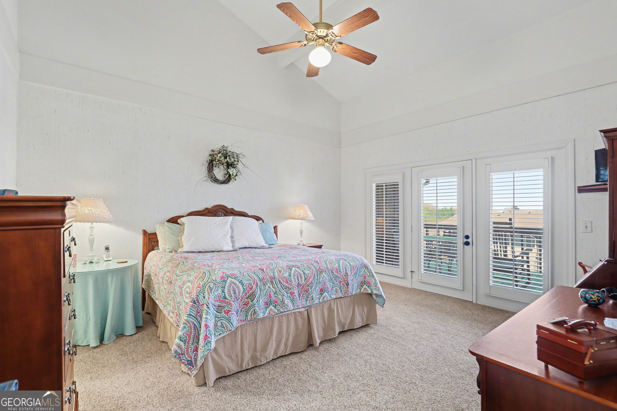 62 Sunvalley Circle, Unit 7006 Dillard, GA 30537 - Photo 25 of 55 a bedroom with a large bed and a chandelier