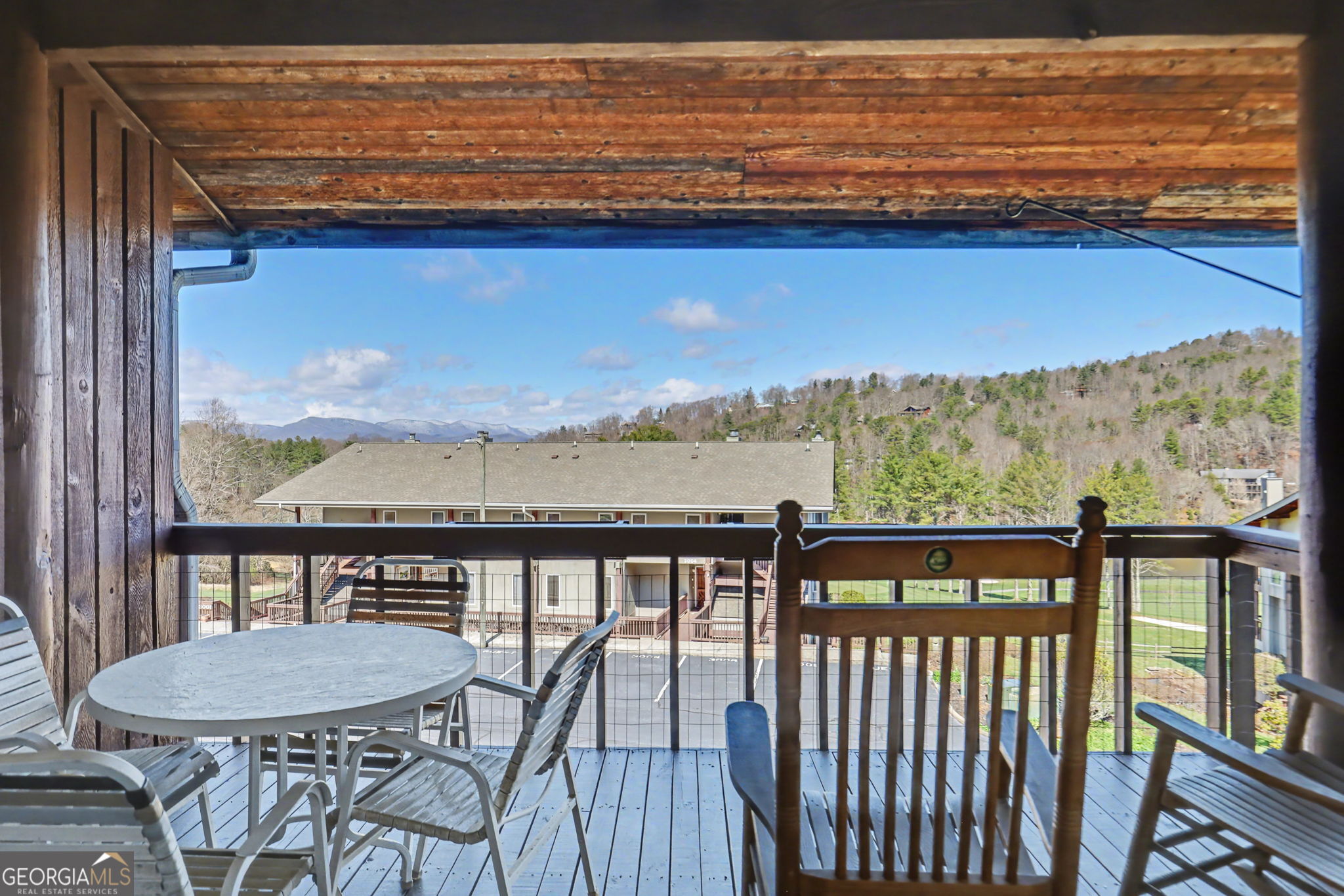 62 Sunvalley Circle, Unit 7006 Dillard, GA 30537 - Photo 26 of 55 a view of a balcony with furniture and wooden floor