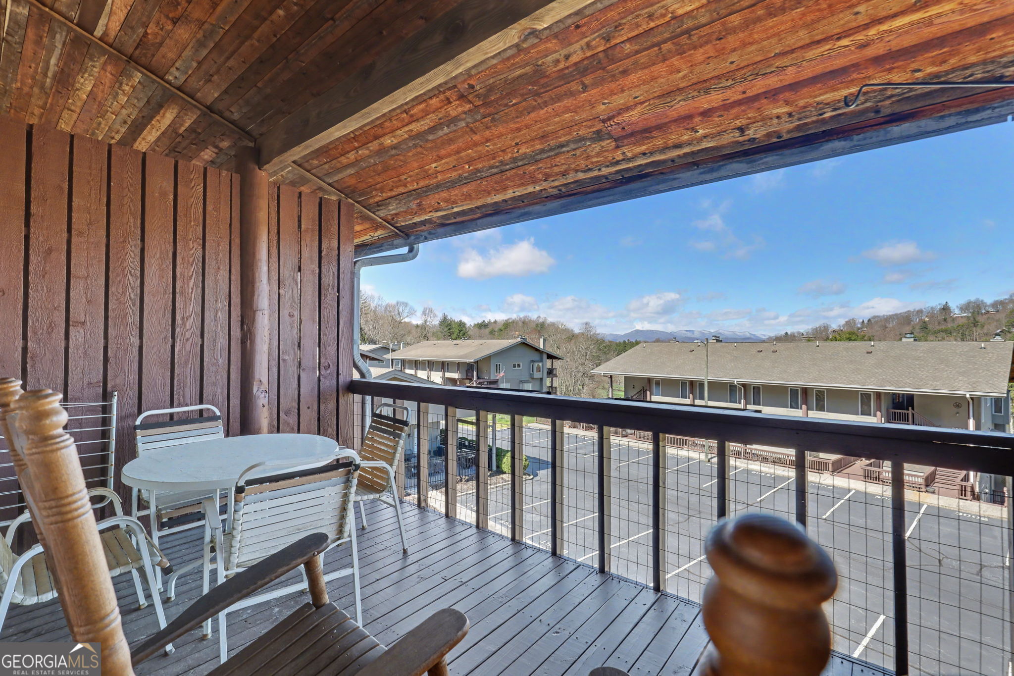 62 Sunvalley Circle, Unit 7006 Dillard, GA 30537 - Photo 27 of 55 a view of a balcony with furniture and wooden deck
