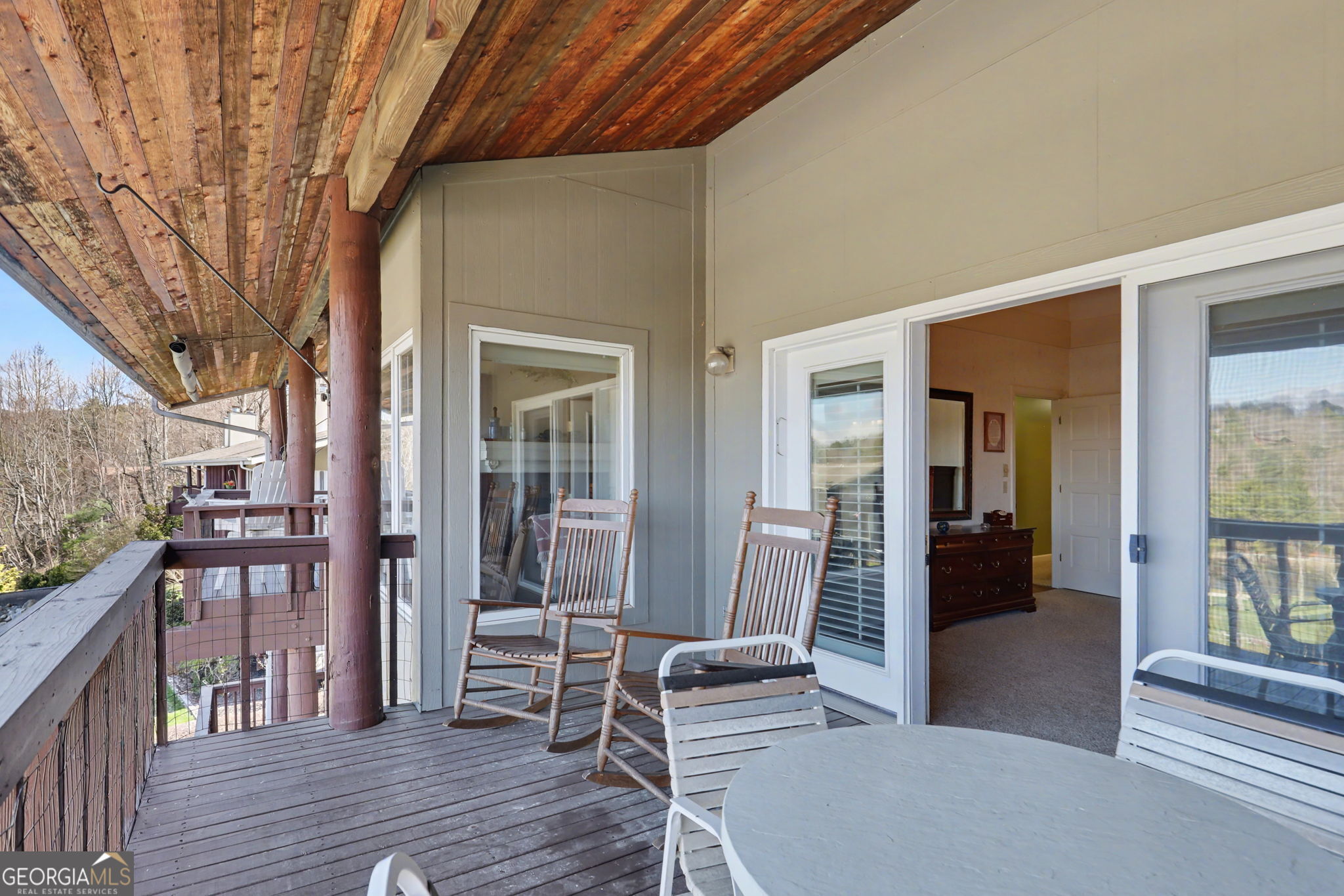 62 Sunvalley Circle, Unit 7006 Dillard, GA 30537 - Photo 28 of 55 a view of a patio with table and chairs and wooden floor