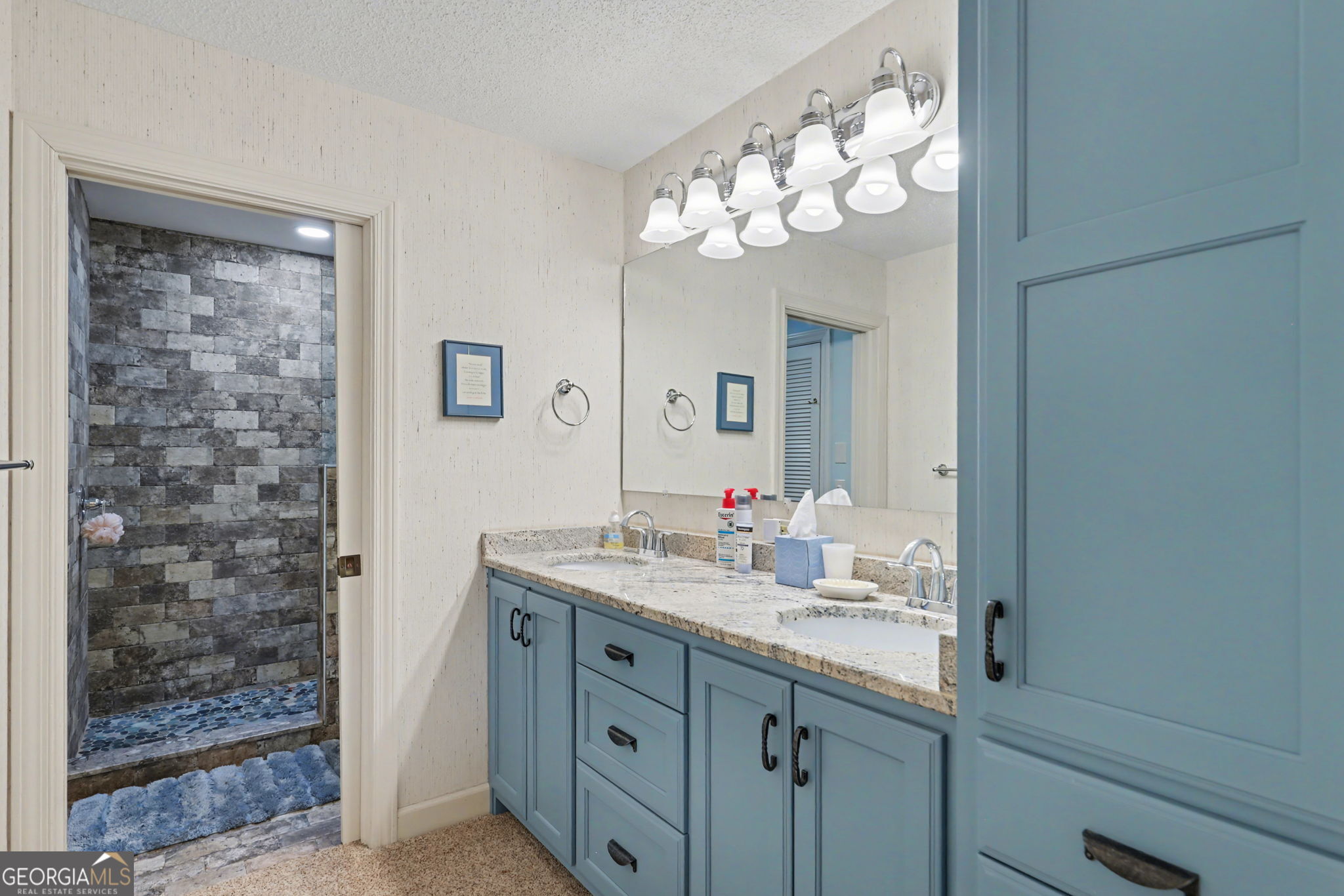 62 Sunvalley Circle, Unit 7006 Dillard, GA 30537 - Photo 31 of 55 a bathroom with a sink vanity and a mirror