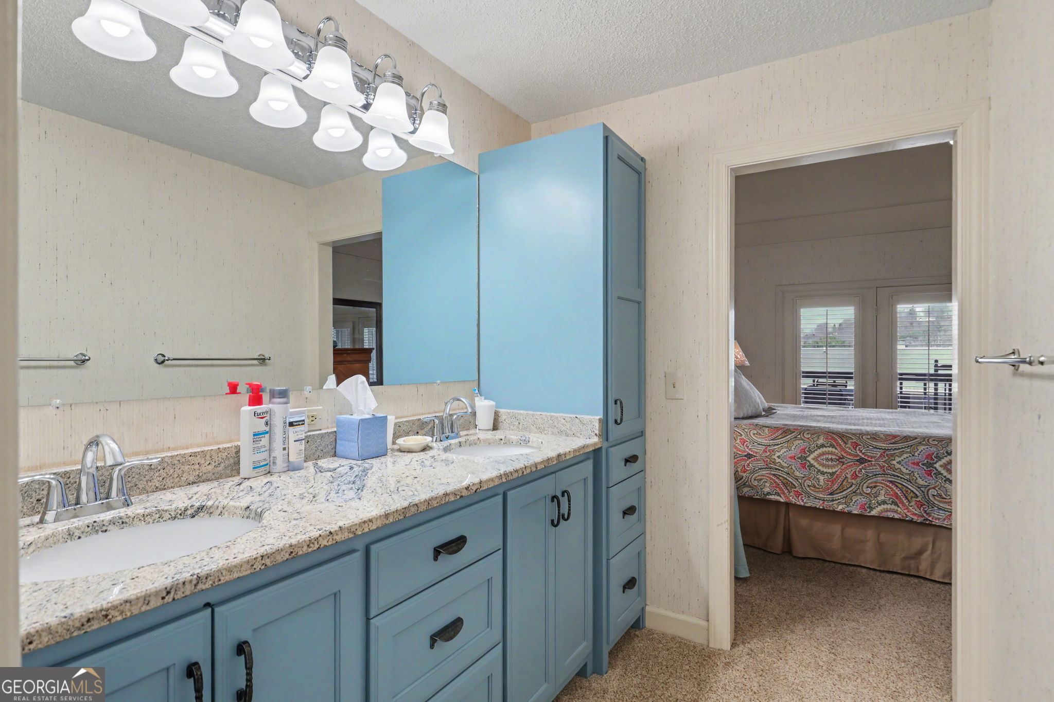 62 Sunvalley Circle, Unit 7006 Dillard, GA 30537 - Photo 33 of 55 a bathroom with a granite countertop double vanity sink and a mirror