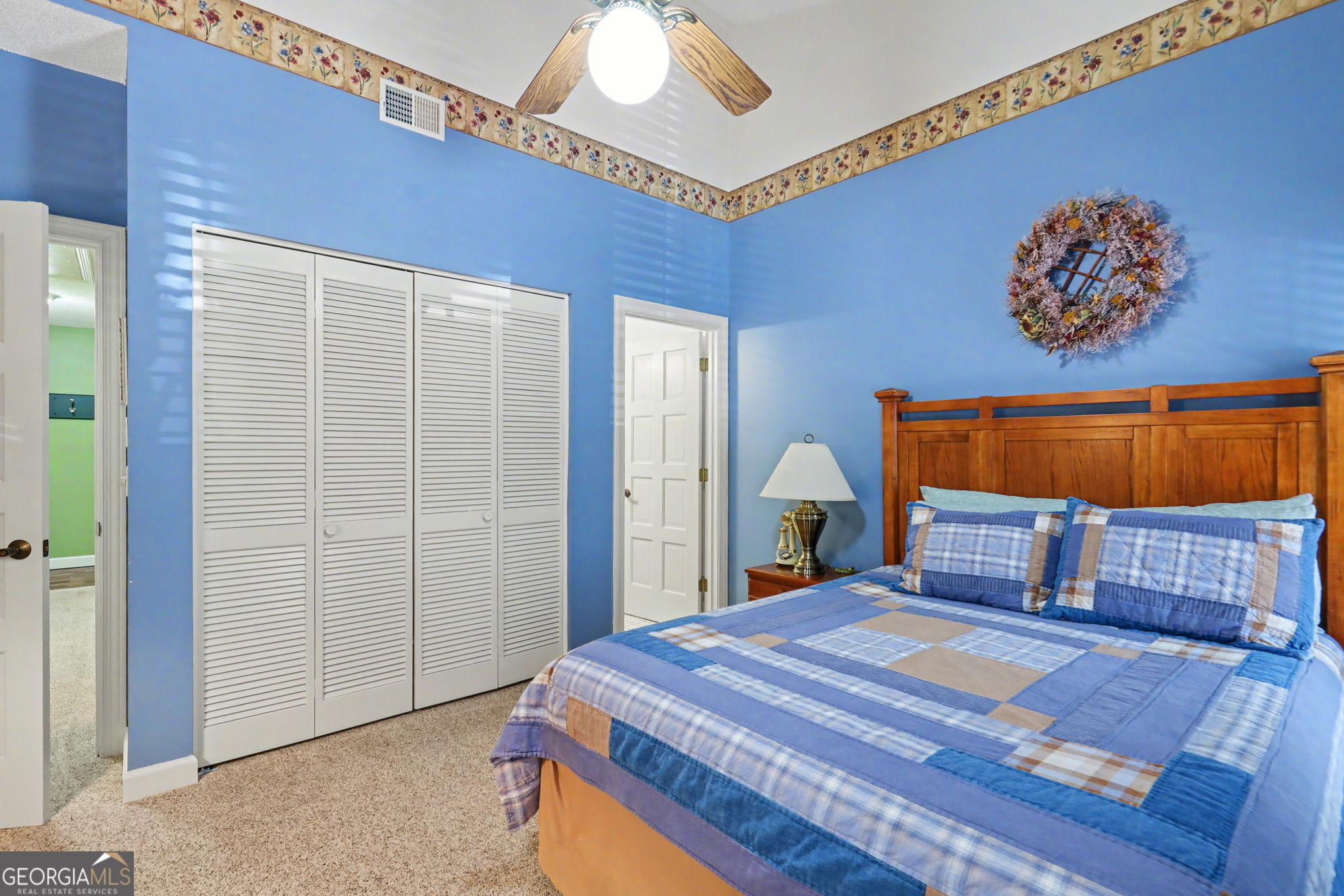 62 Sunvalley Circle, Unit 7006 Dillard, GA 30537 - Photo 39 of 55 a bedroom with a large bed and a chandelier
