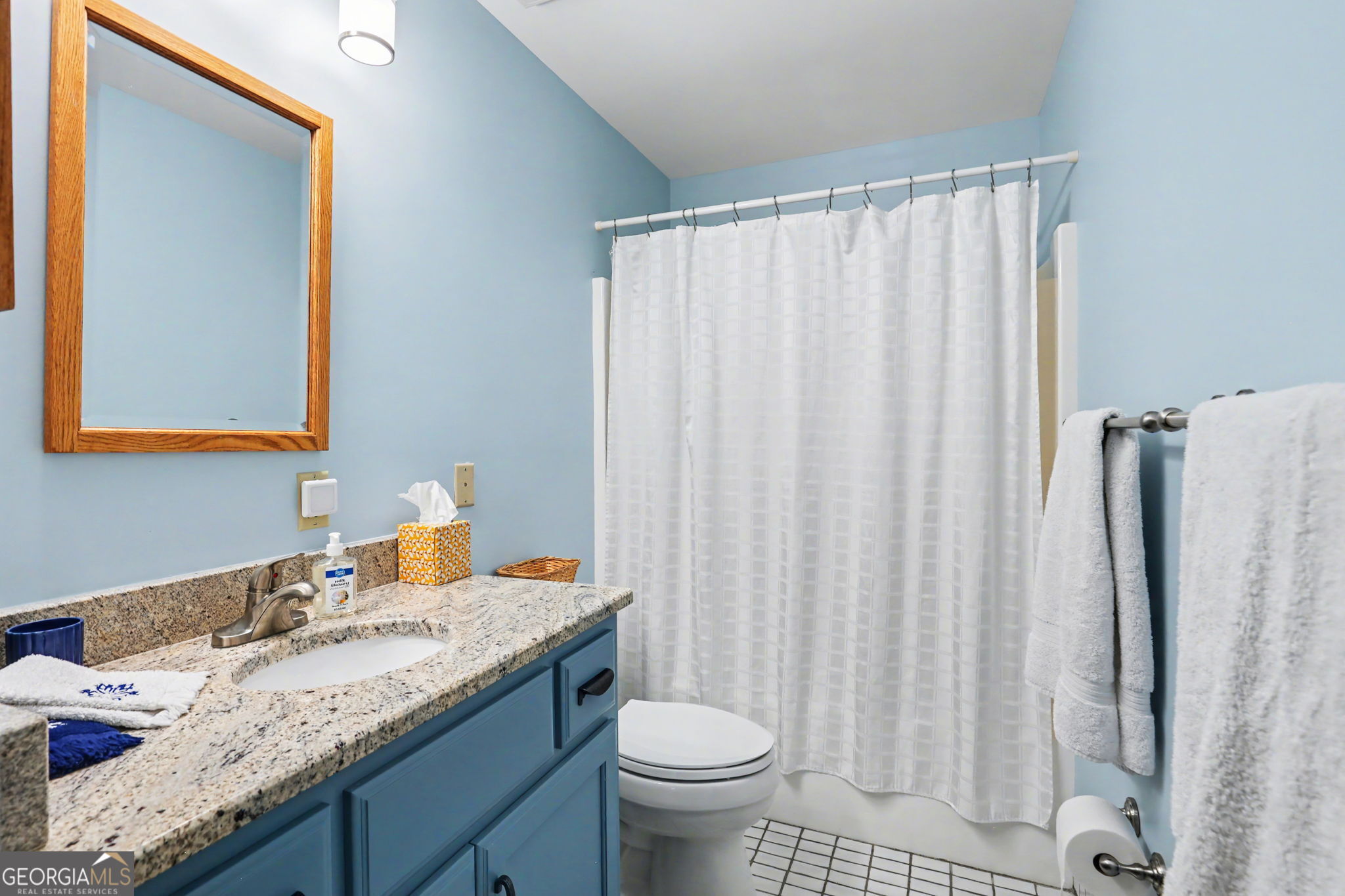 62 Sunvalley Circle, Unit 7006 Dillard, GA 30537 - Photo 40 of 55 a bathroom with a granite countertop sink and a mirror