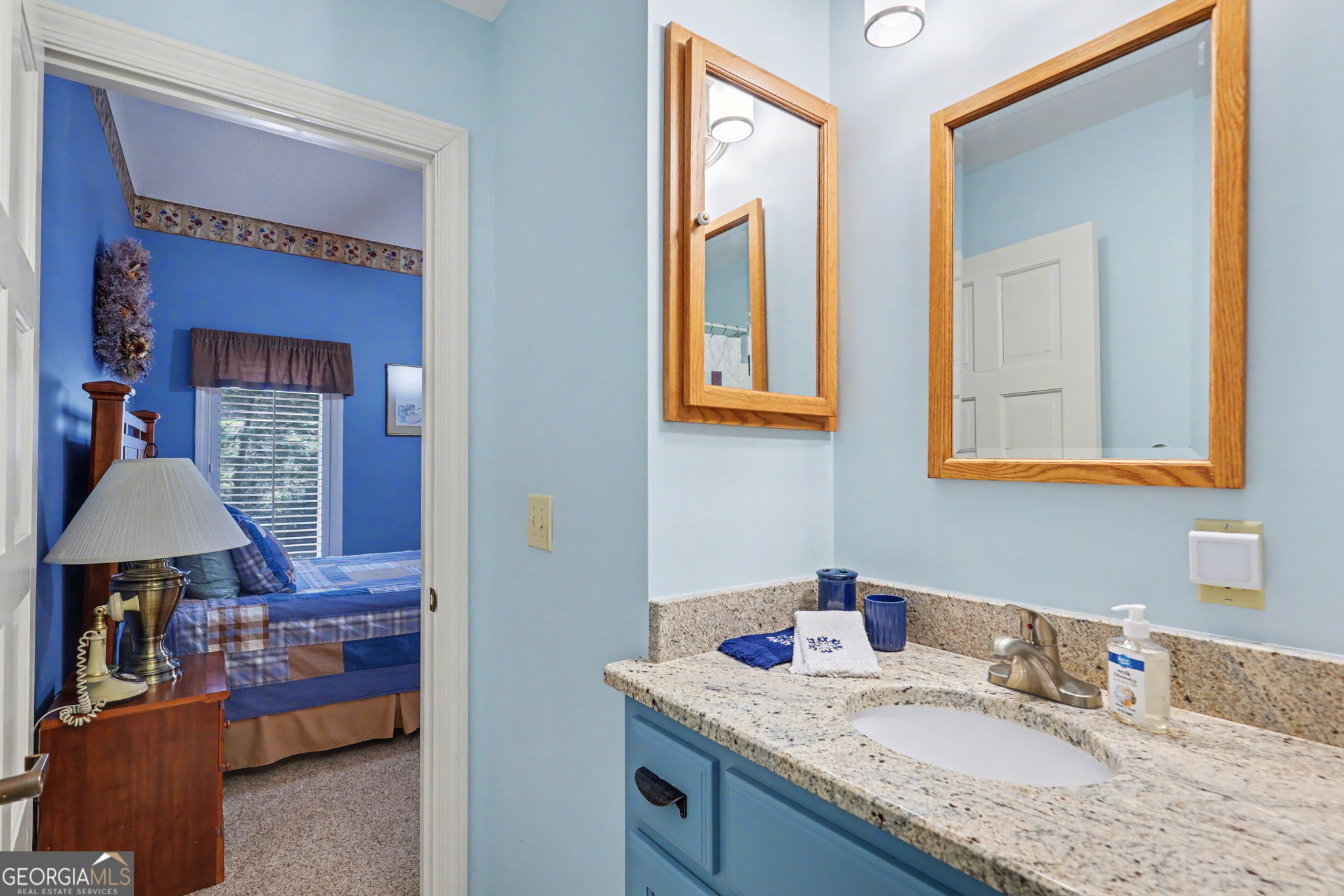62 Sunvalley Circle, Unit 7006 Dillard, GA 30537 - Photo 41 of 55 a en suite bathroom with a granite countertop sink and a mirror