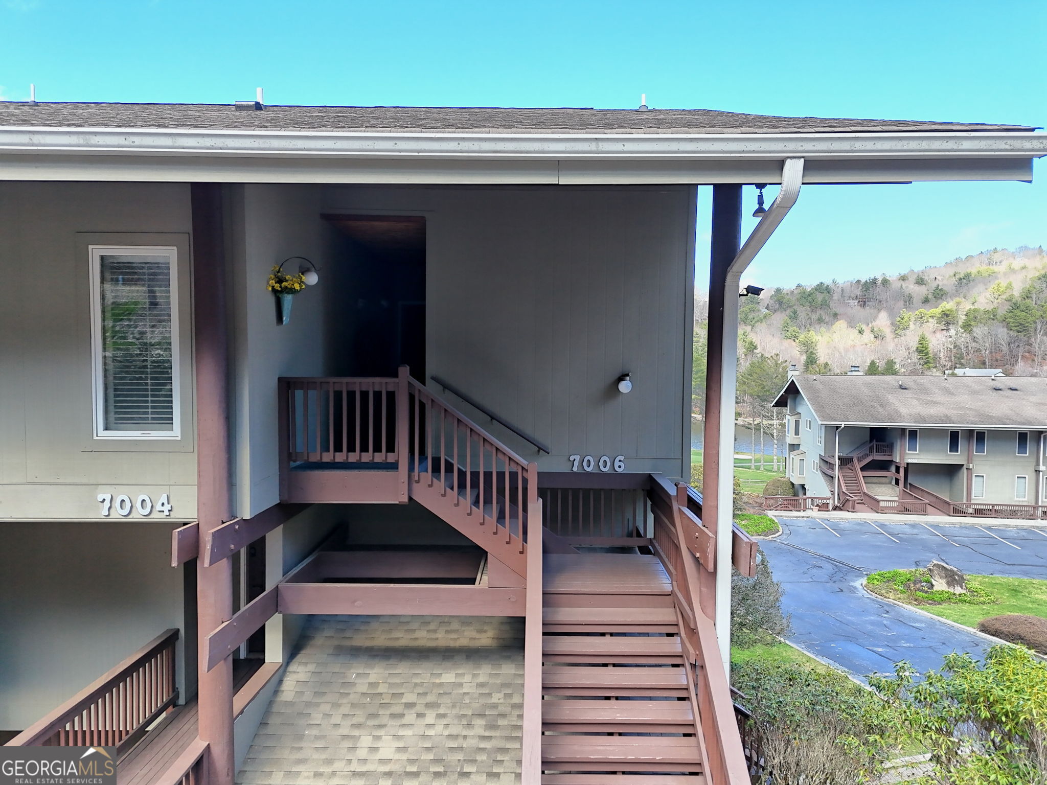 62 Sunvalley Circle, Unit 7006 Dillard, GA 30537 - Photo 55 of 55 a view of a porch with furniture and a gate