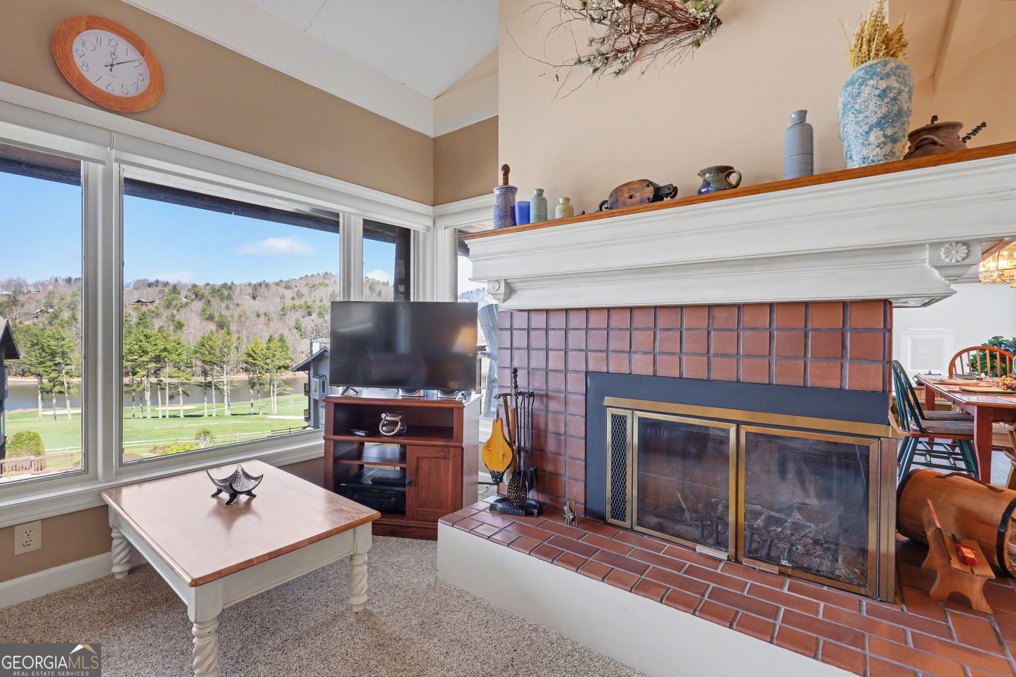 62 Sunvalley Circle, Unit 7006 Dillard, GA 30537 - Photo 8 of 55 a living room with fireplace furniture and a window